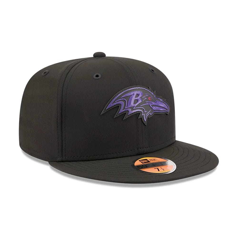 Baltimore Ravens NFL Sideline 2026 Black New Era 59FIFTY Fitted Cap, three-quarter view showing the raised purple and black Baltimore Ravens logo on the front panel, a flat black visor with a gold 59FIFTY size sticker on the top.