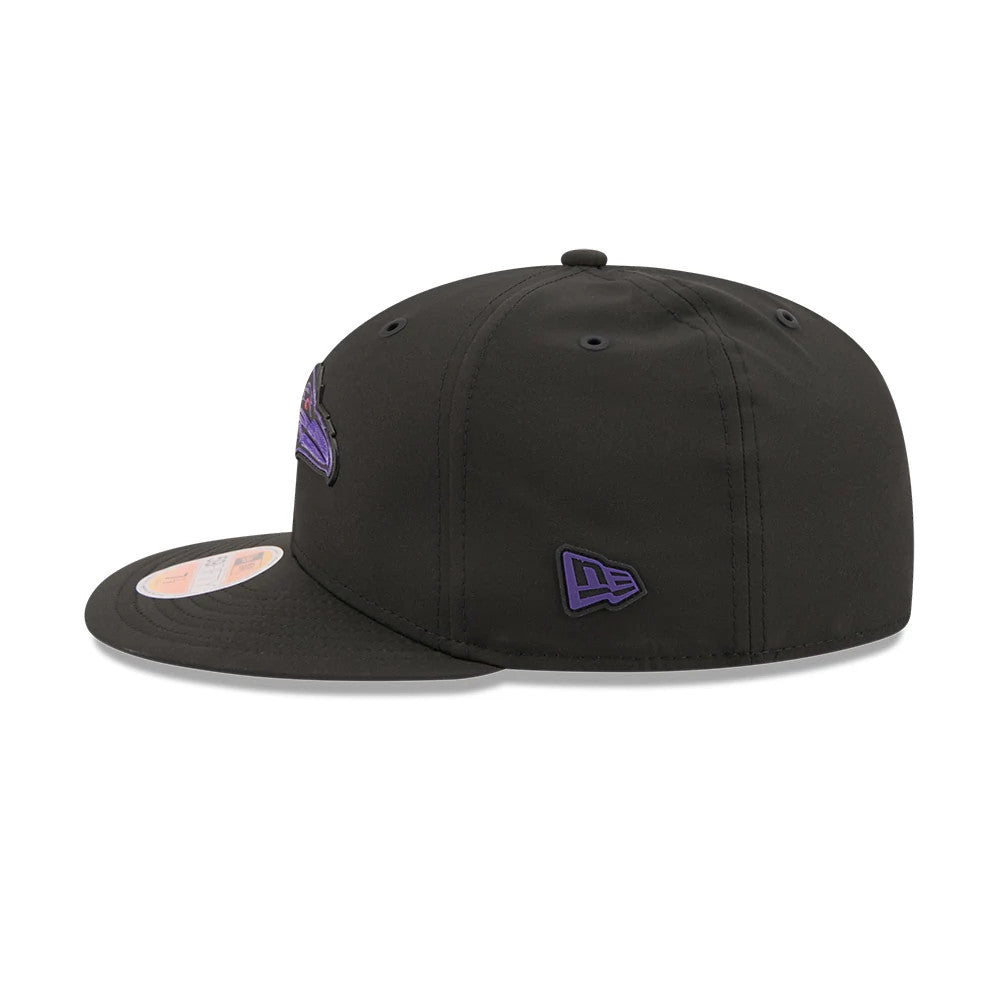 Baltimore Ravens NFL Sideline 2026 Black New Era 59FIFTY Fitted Cap, side view showing the purple embroidered New Era flag logo on the left side of the structured black crown, with a flat black visor and the 59FIFTY size sticker on the visor's edge.