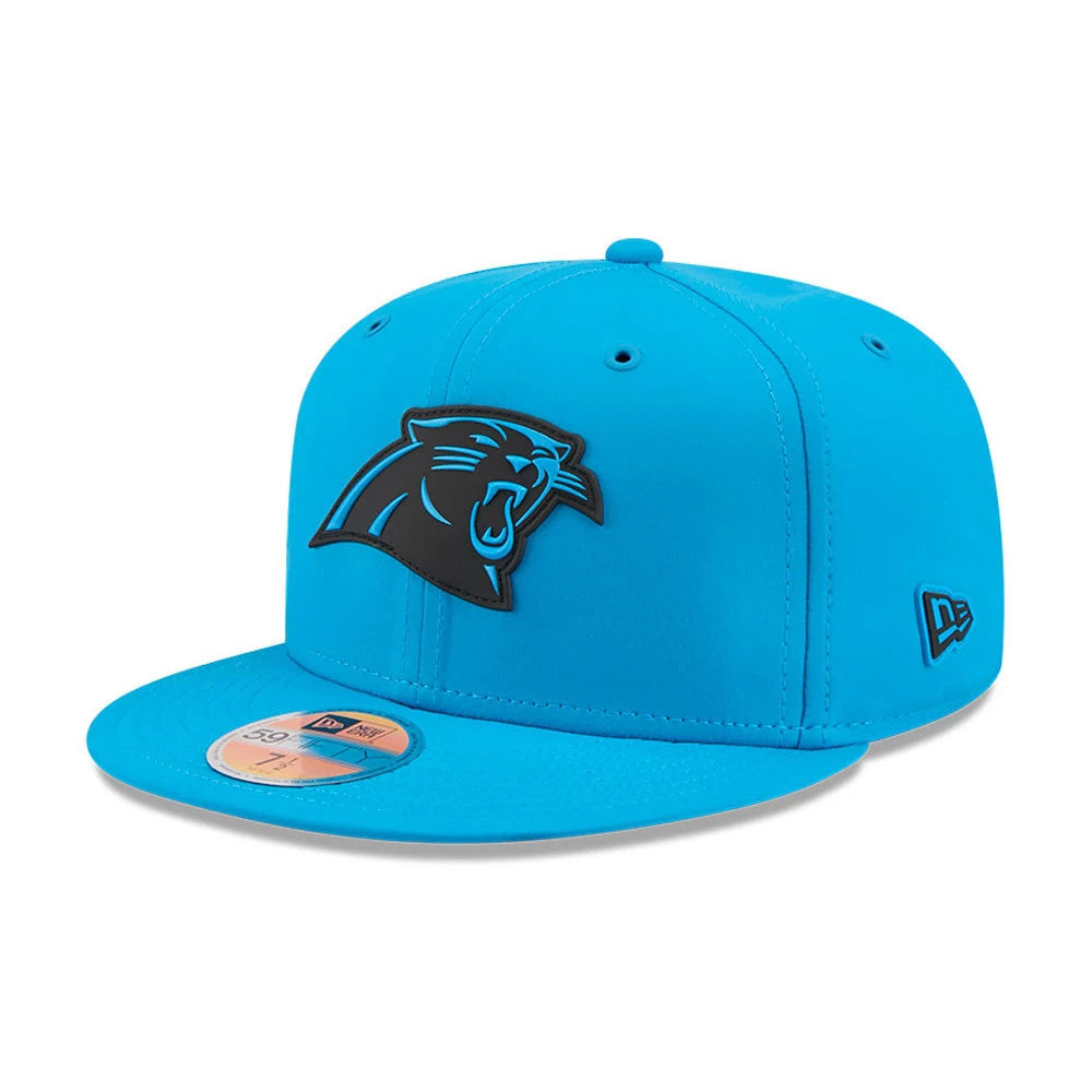 Carolina Panthers NFL Sideline 2026 Blue New Era 59FIFTY Fitted Cap, three-quarter view showing the raised black panther logo on the front panel, the blue flat visor with a gold 59FIFTY size sticker, and the New Era flag logo on the left side.