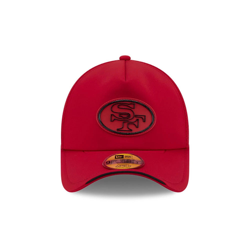 San Francisco 49ers NFL Sideline 2026 Red New Era 9FORTY Apex Adjustable Cap, front view showing a raised black embroidered SF logo on the front panel above the pre-curved visor and a gold 9FORTY size sticker on the red visor.