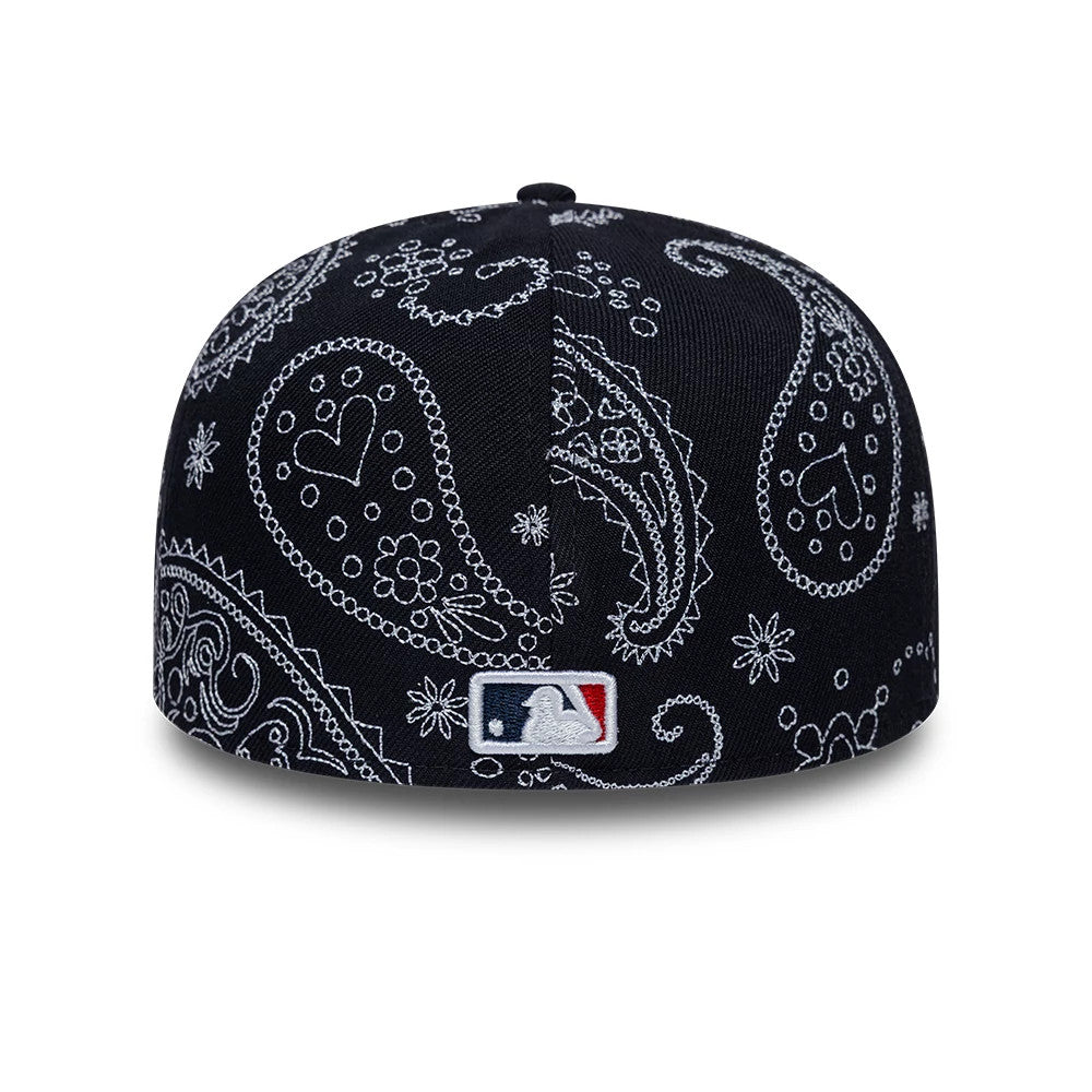 New York Yankees MLB All Over Paisley Navy Low Profile New Era 59FIFTY Fitted Cap, rear view showing the white embroidered MLB Batterman logo at the centre back, surrounded by intricate white paisley patterns across the navy structured crown.