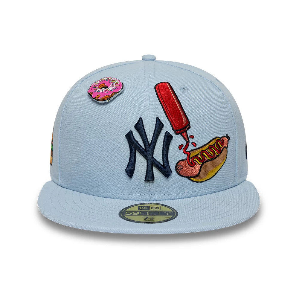 New York Yankees MLB Food Pastel Blue New Era 59FIFTY Fitted Cap, front view showing a navy NY logo with playful food-themed graphics of a hotdog with a ketchup bottle and a doughnut on the structured pastel blue crown.