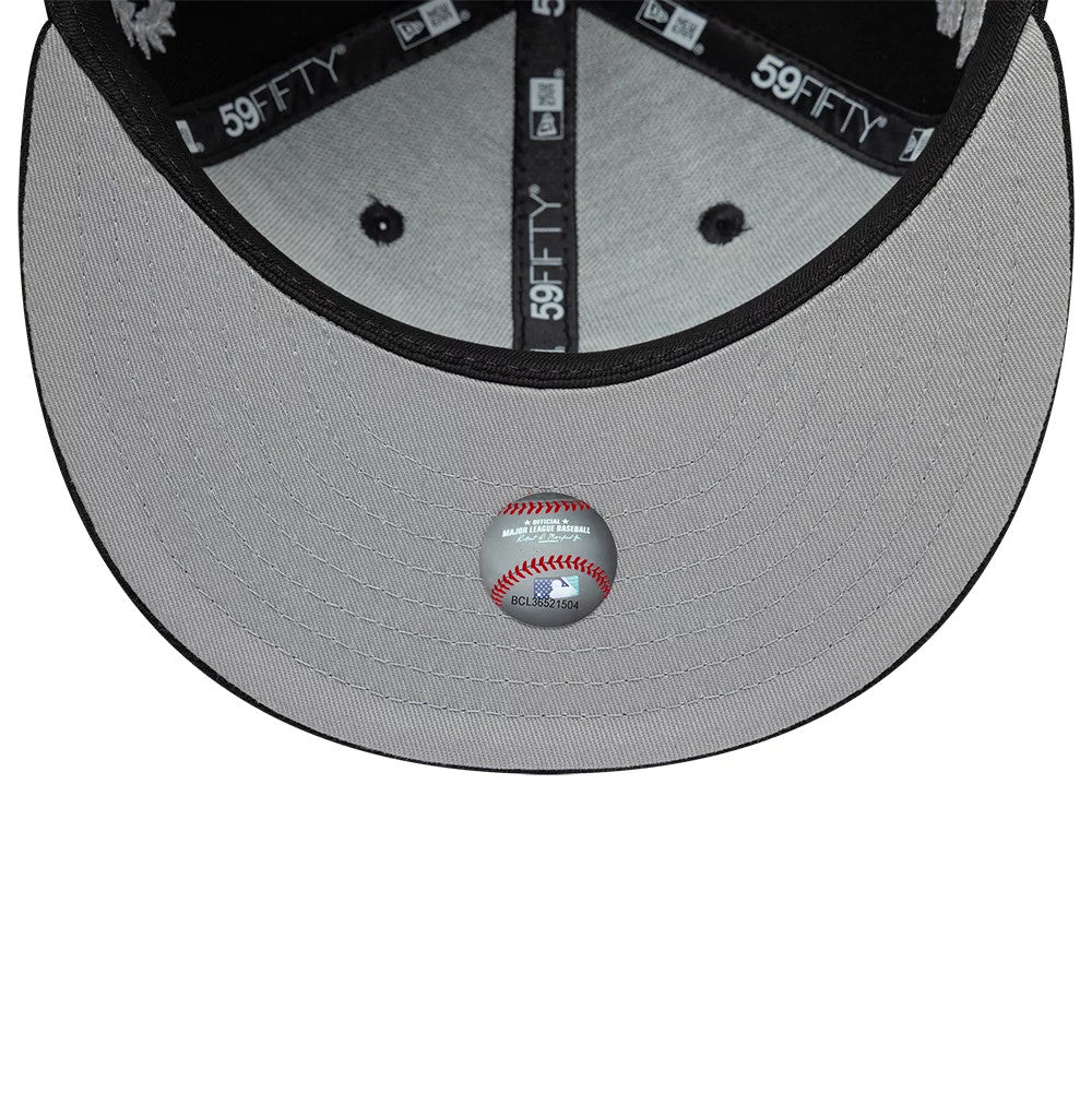 Chicago White Sox MLB Mythical Black New Era 59FIFTY Fitted Cap, inside view showing the grey undervisor with a printed sticker, black sweatband with repeated 59FIFTY branding, and black taping along the seams featuring the New Era logo.