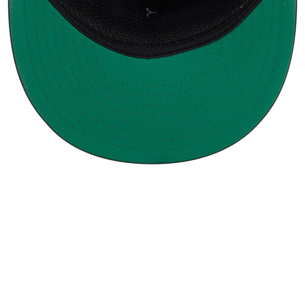 Eagles Youth NFL Sideline 2026 Charcoal New Era 9FIFTY Snapback Adjustable Cap, inside view showing a green undervisor, a black sweatband encircling the interior of the cap, and black taping along the crown seams.