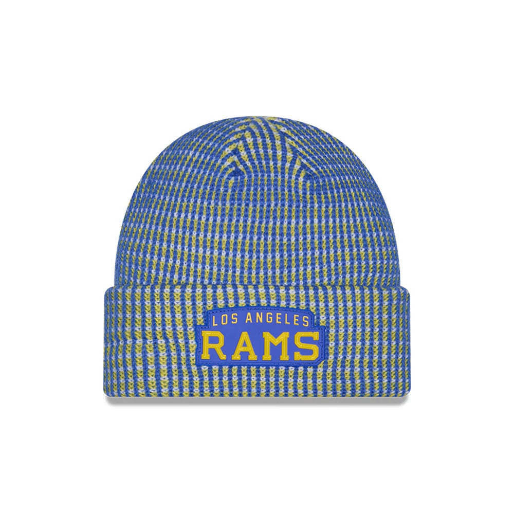 New Era LA Rams NFL Sideline 2026 Blue Cuff Knit Beanie Hat, front view showing a blue and yellow knitted pattern with a sewn Los Angeles Rams logo patch on the raised cuff, featuring yellow lettering on a blue background.