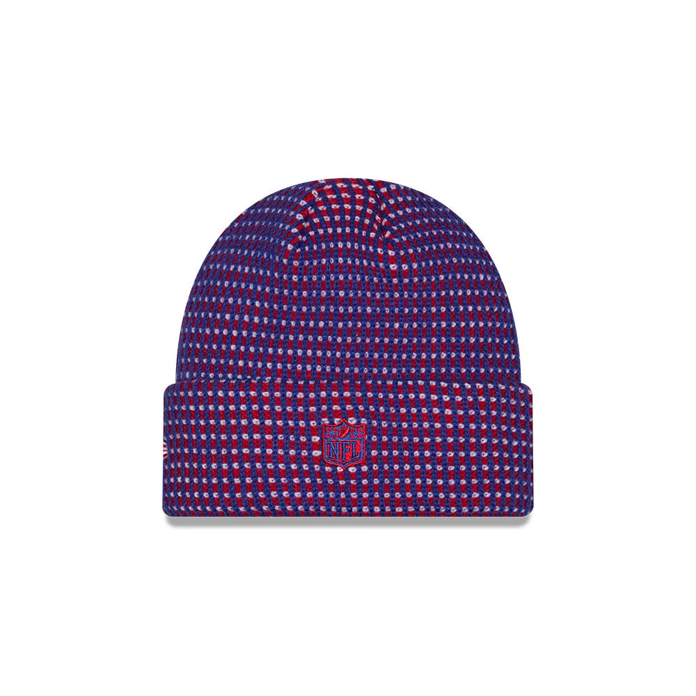 New Era New England Patriots NFL Sideline 2026 Blue Cuff Knit Beanie Hat, front view showing a red and blue grid pattern knit design with the embroidered red NFL shield logo on the folded cuff and a structured round shape.