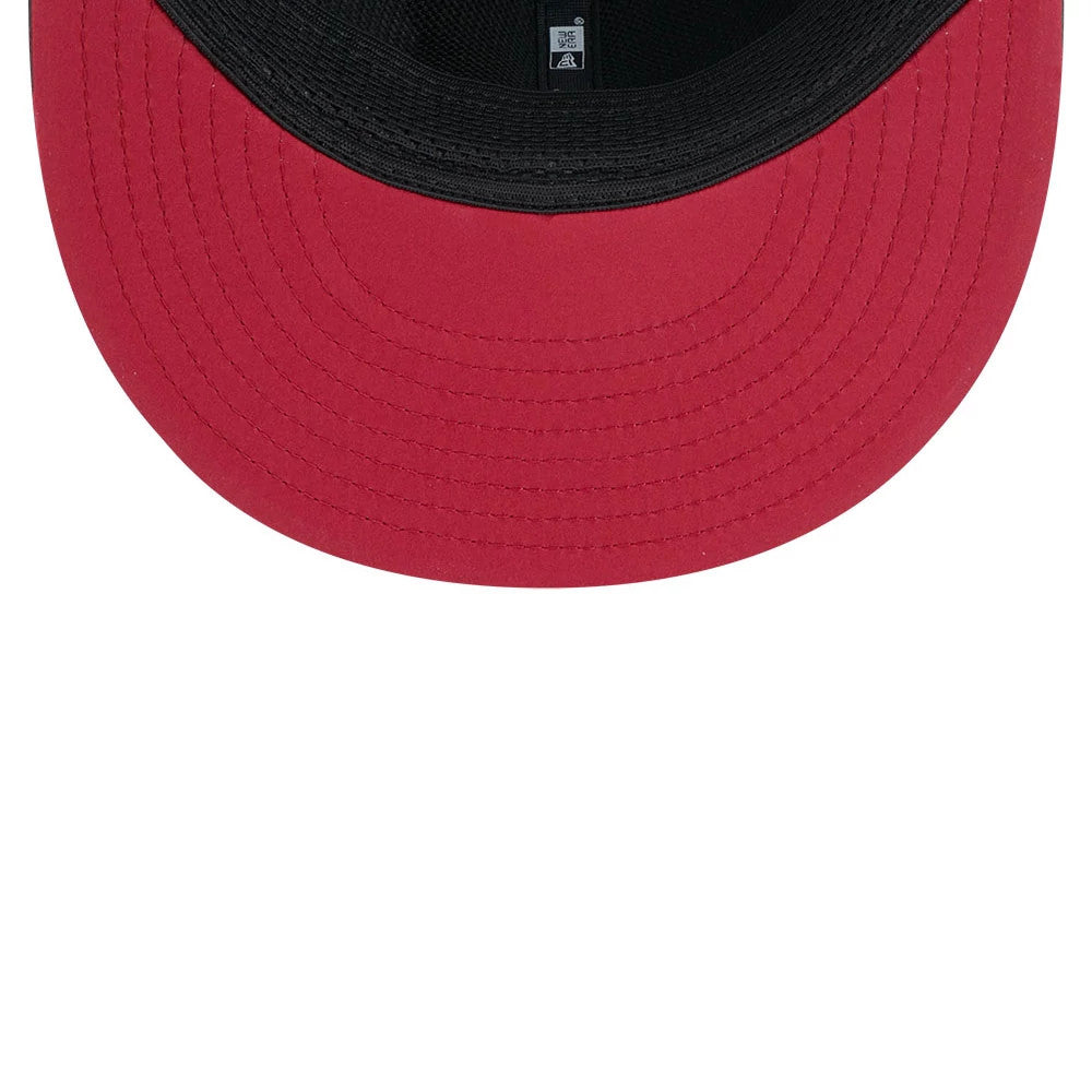 Cardinals NFL Sideline 2026 Charcoal New Era 9FIFTY Snapback Adjustable Cap, inside view showing the bright red undervisor with neat stitching, a black sweatband encircling the interior, and black taping along the seams for a clean finish.