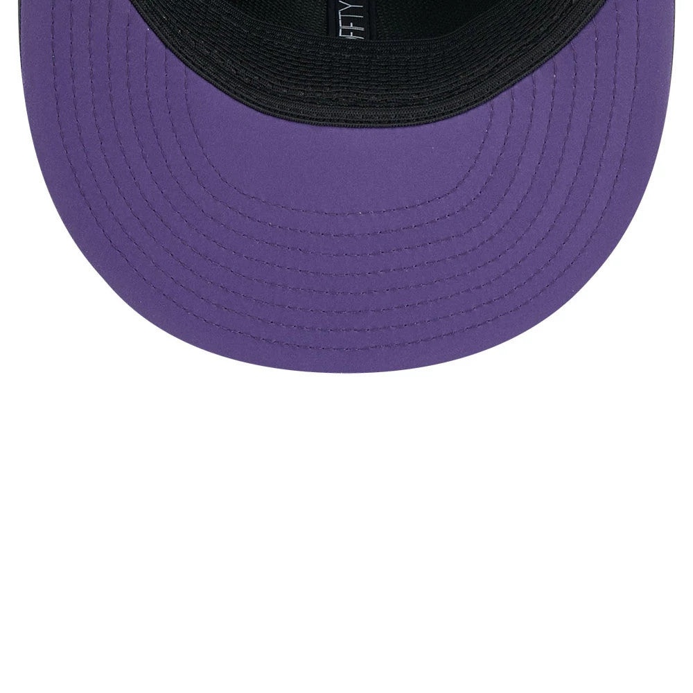 Vikings NFL Sideline 2026 Charcoal New Era 9FIFTY Snapback Adjustable Cap, inside view showing the solid purple undervisor, black sweatband with white 9FIFTY lettering, and detailed black taping.