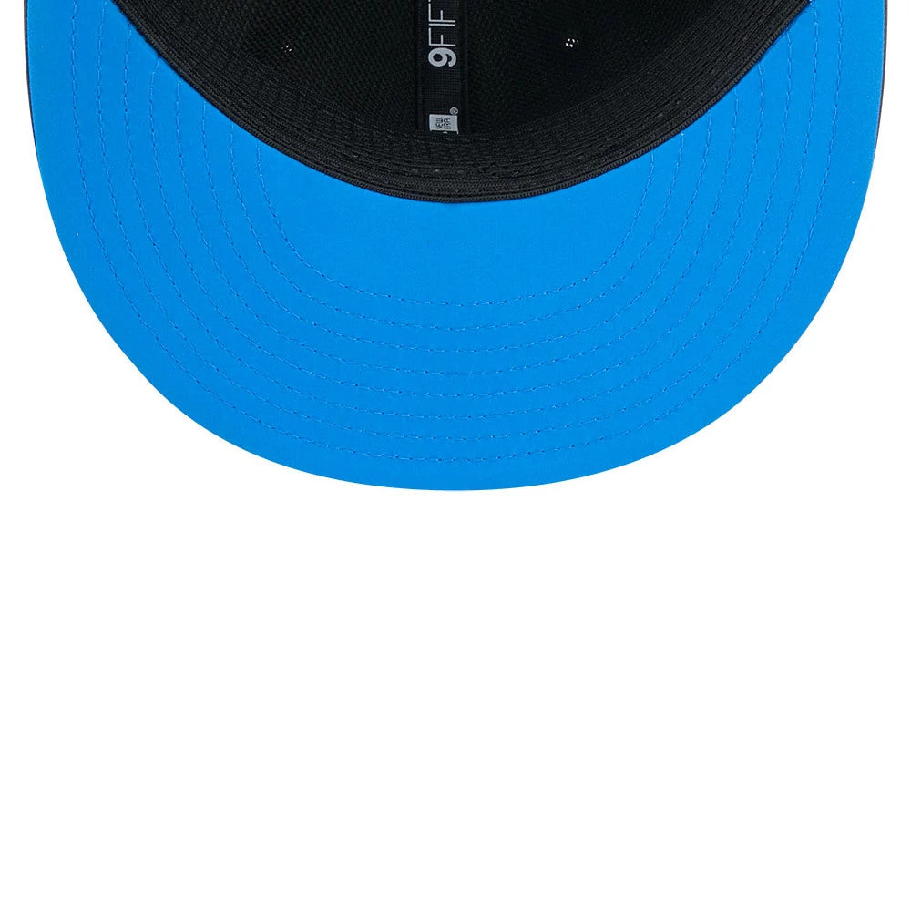 Detroit Lions NFL Sideline 2026 Charcoal New Era 9FIFTY Snapback Adjustable Cap, inside view showing a bright blue undervisor, black interior sweatband, and the 9FIFTY logo taping running along the centre of the cap panel seams.