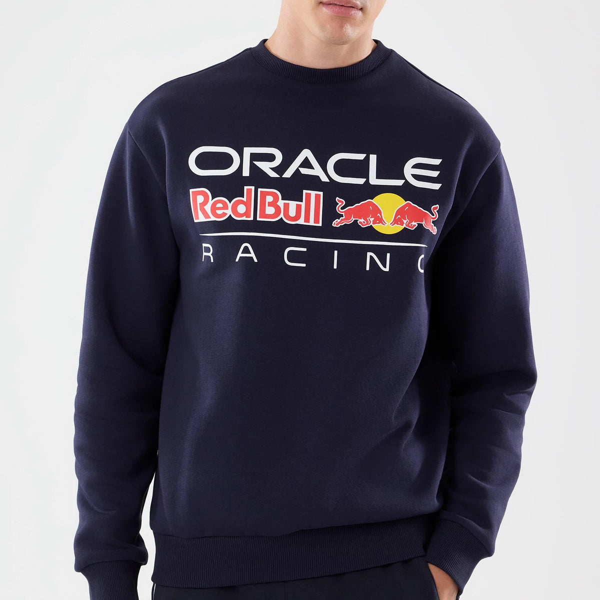 The model is wearing this Red Bull Racing Oversized Crew Neck Sweater in dark blue. 3