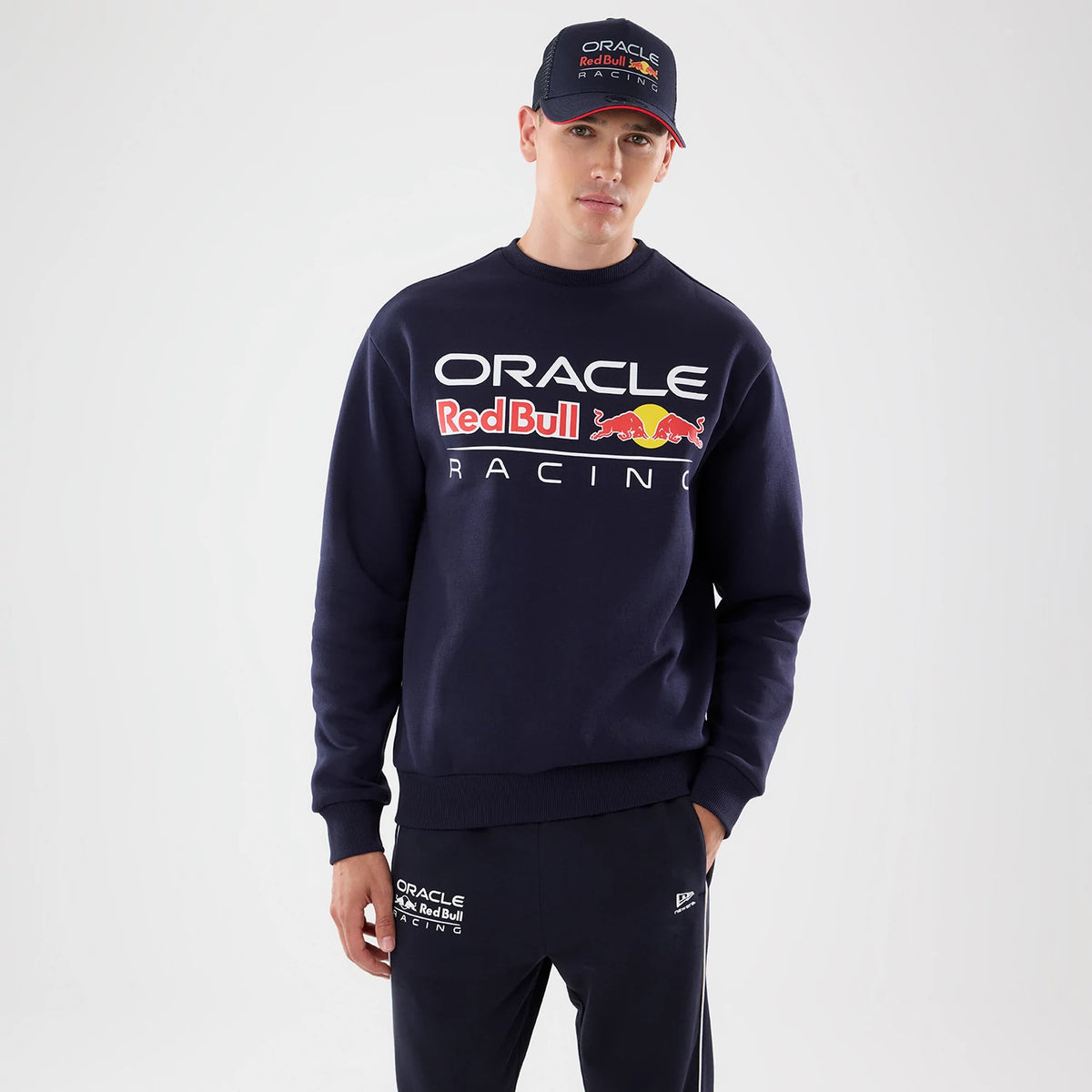 The model is wearing this Red Bull Racing Oversized Crew Neck Sweater in dark blue. 1