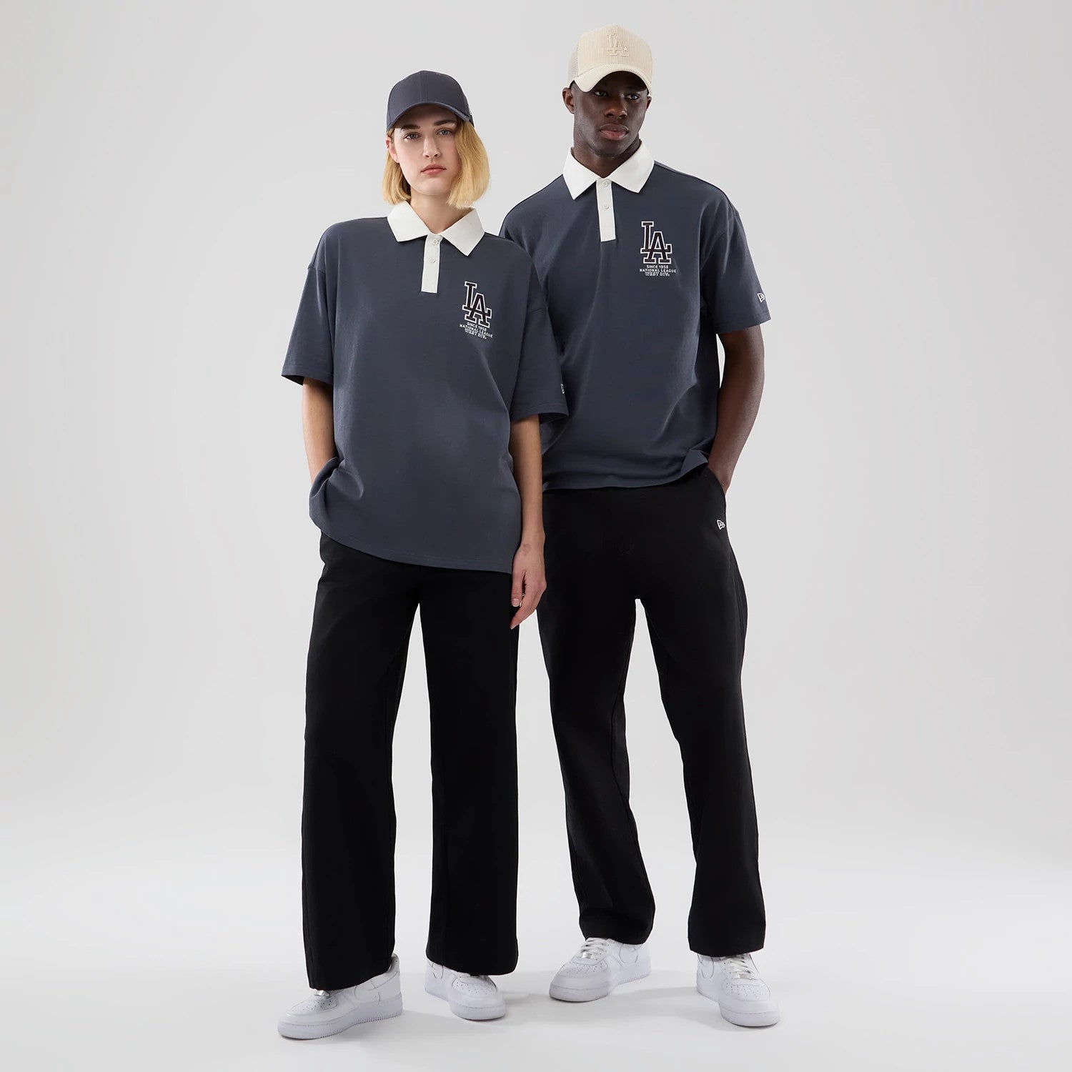 The model is wearing this MLB LA Dodgers Polo T-Shirt in grey. 1