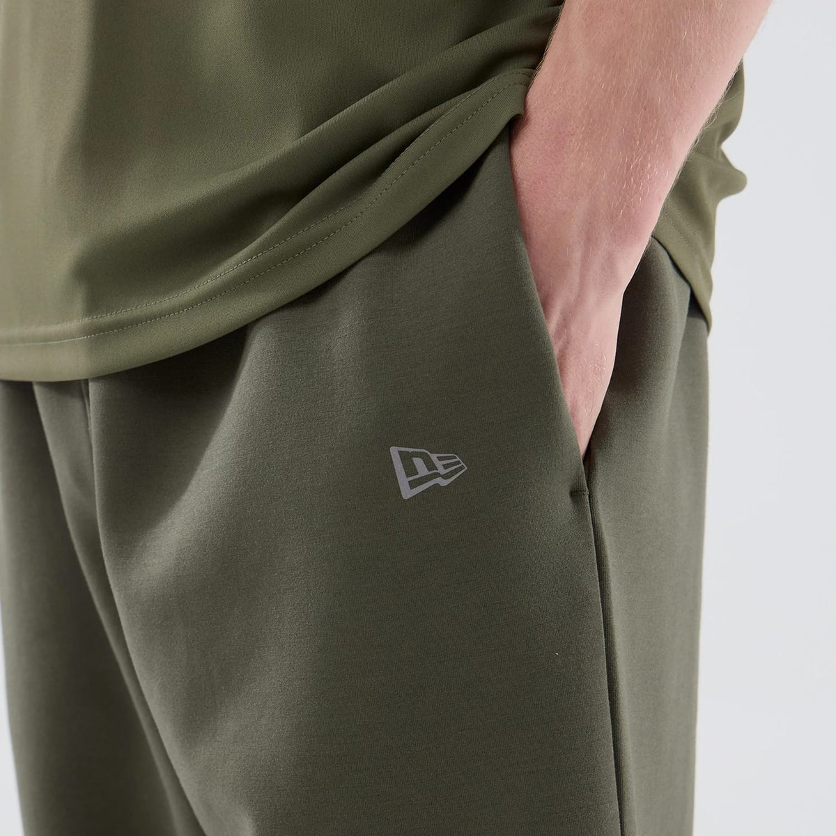 The model is wearing these MLB Core Plus New York Yankees Joggers in green. 4