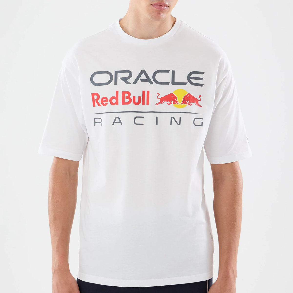 The model is wearing this Red Bull Racing Graphic Oversized T-Shirt in white. 3