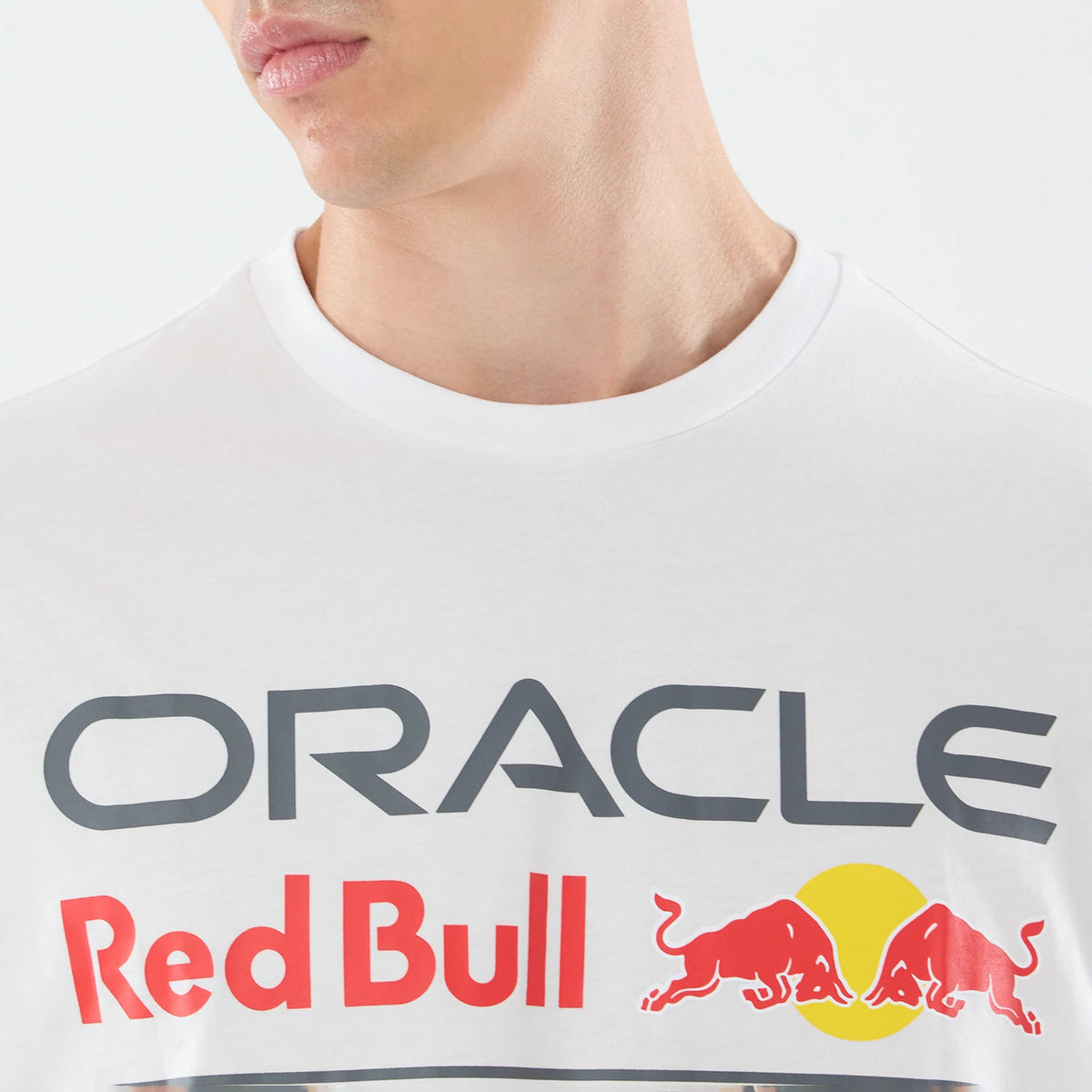 New Era Red Bull Racing Graphic White Oversized T-Shirt, front view on a model displaying large printed Oracle lettering across the chest, with Red Bull text below and the Red Bull logo featuring two bulls and a yellow circle.