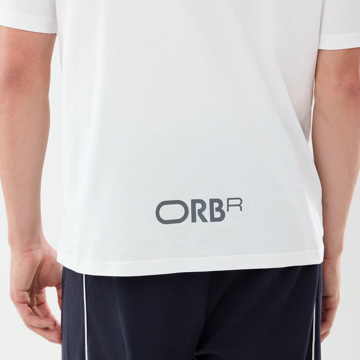The model is wearing this Red Bull Racing Graphic Oversized T-Shirt in white. 7