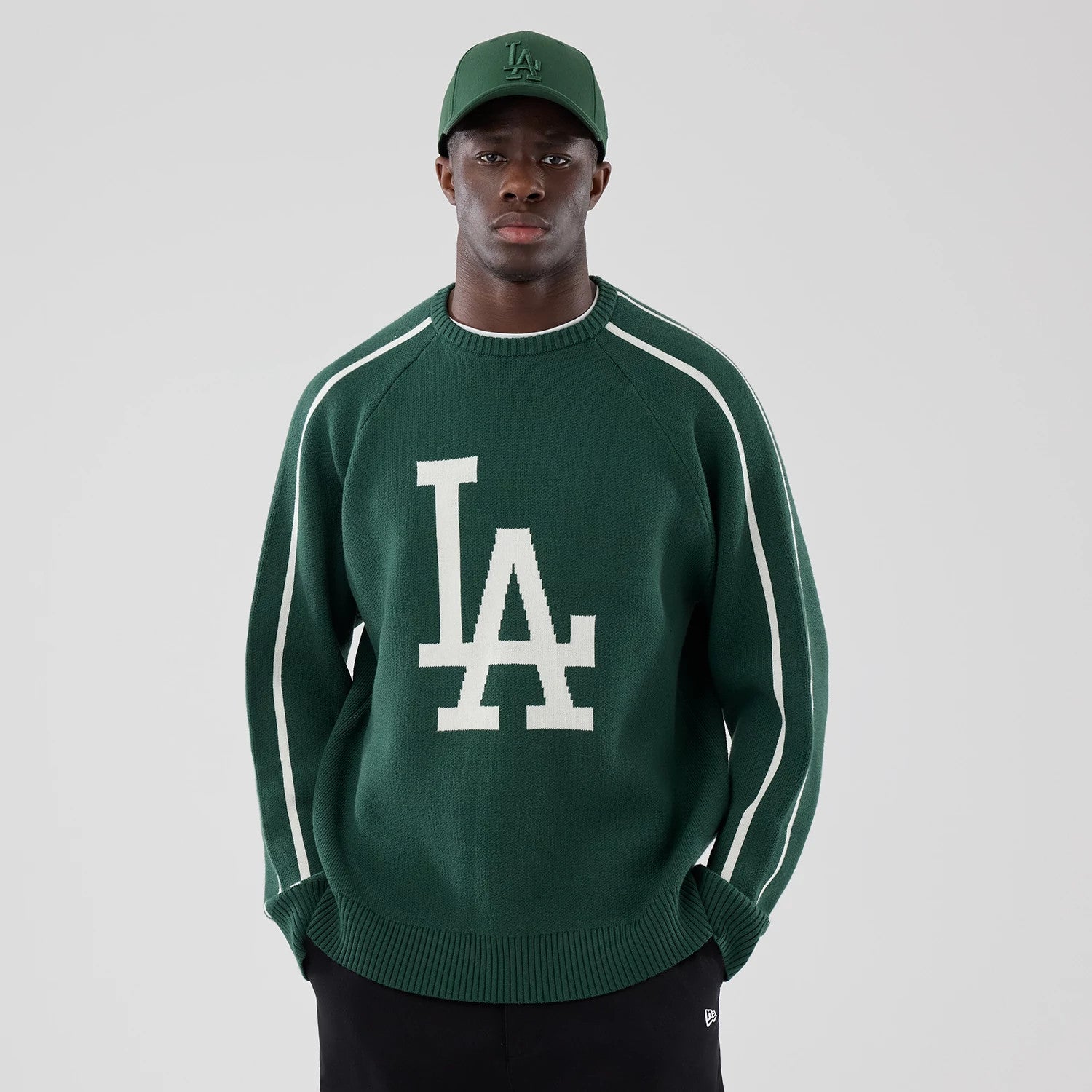 The model is wearing this MLB Knit LA Dodgers Knitted Sweater in dark green. 1