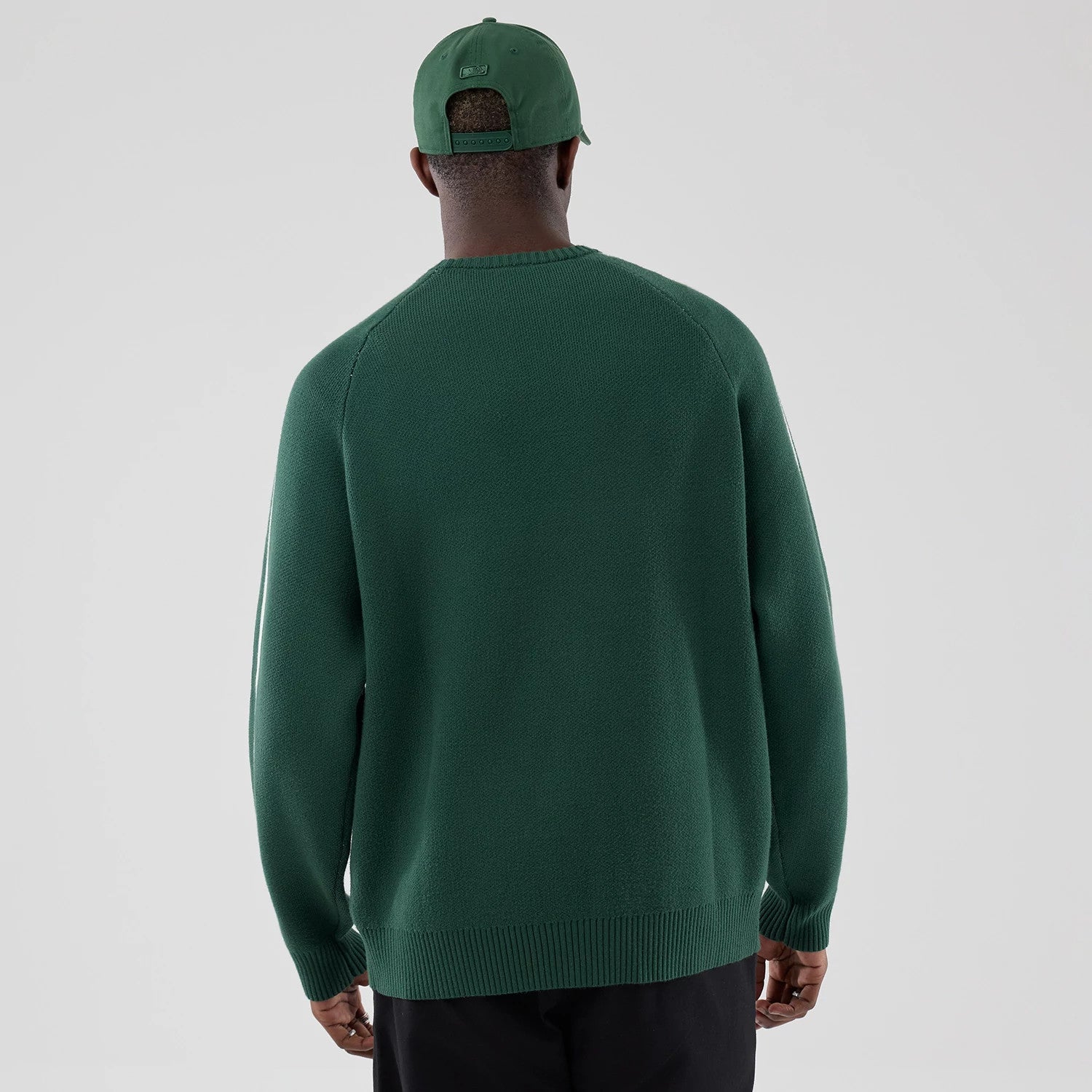 The model is wearing this MLB Knit LA Dodgers Knitted Sweater in dark green. 2