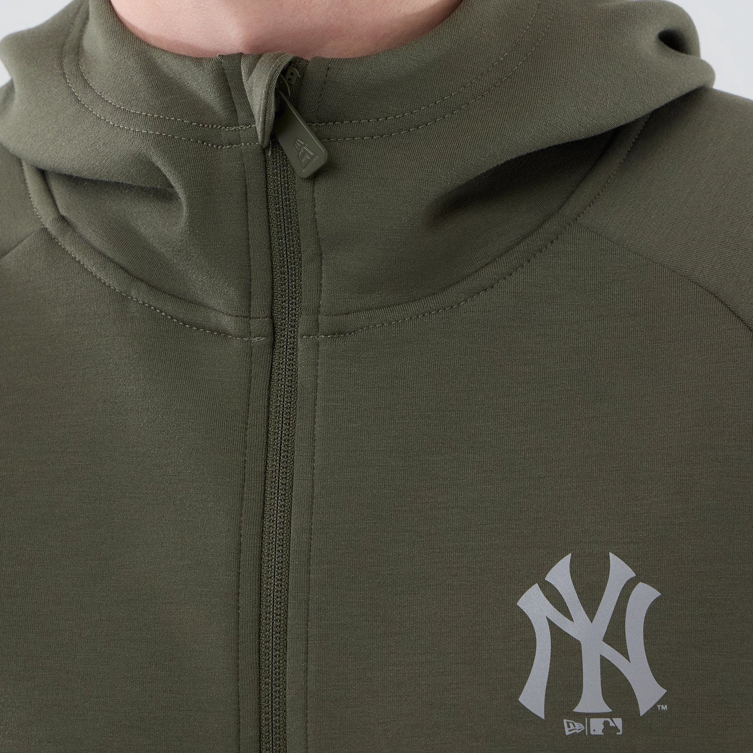 The model is wearing this MLB Core Plus New York Yankees Full Zip Hoodie in green. 4