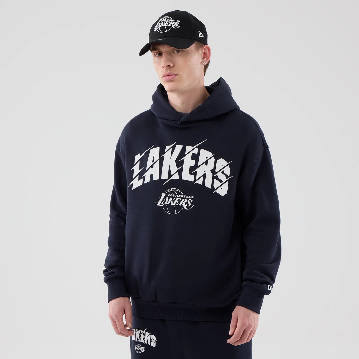 The model is wearing this NBA Core Plus LA Lakers Pullover Hoodie in navy. 1