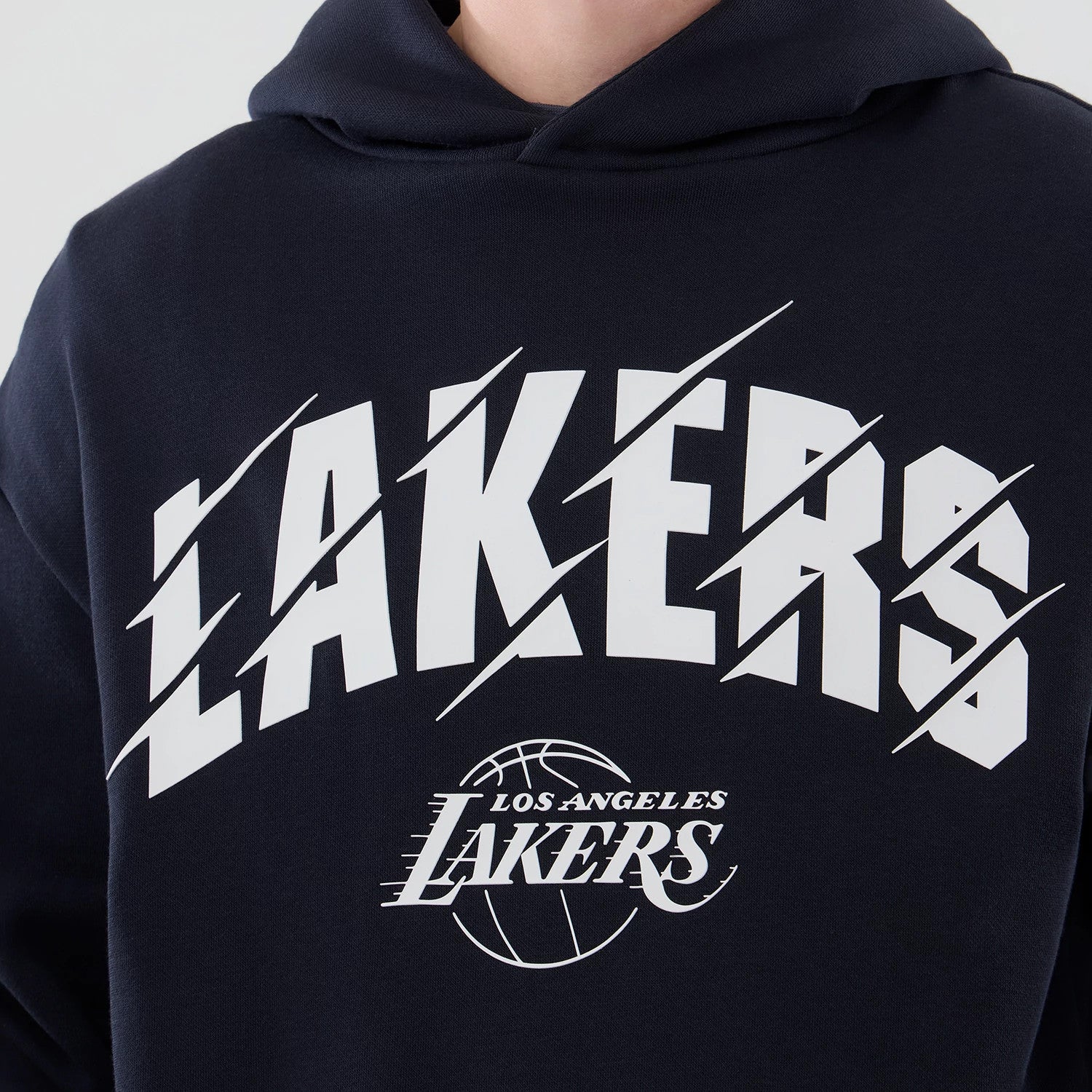 The model is wearing this NBA Core Plus LA Lakers Pullover Hoodie in navy. 4