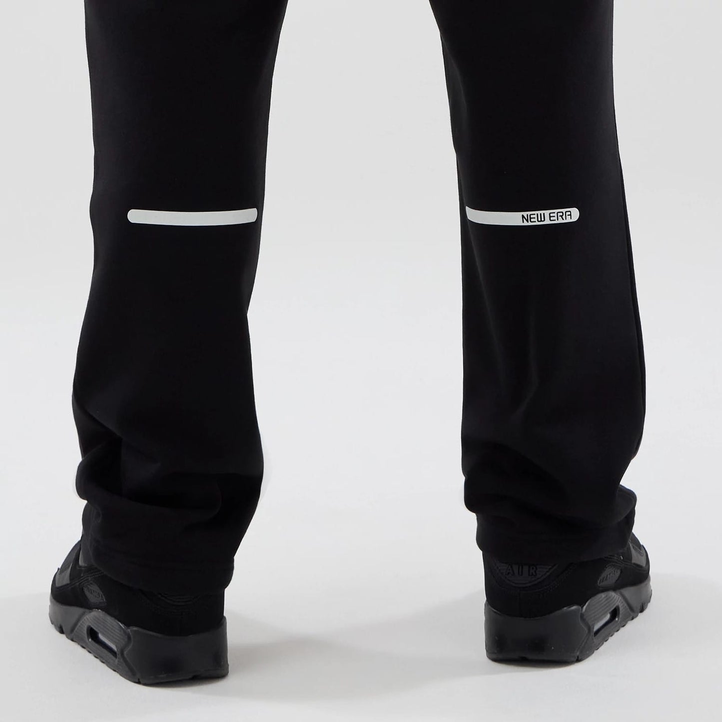 The model is wearing these New Era Tech Straight Leg Joggers in black. 7