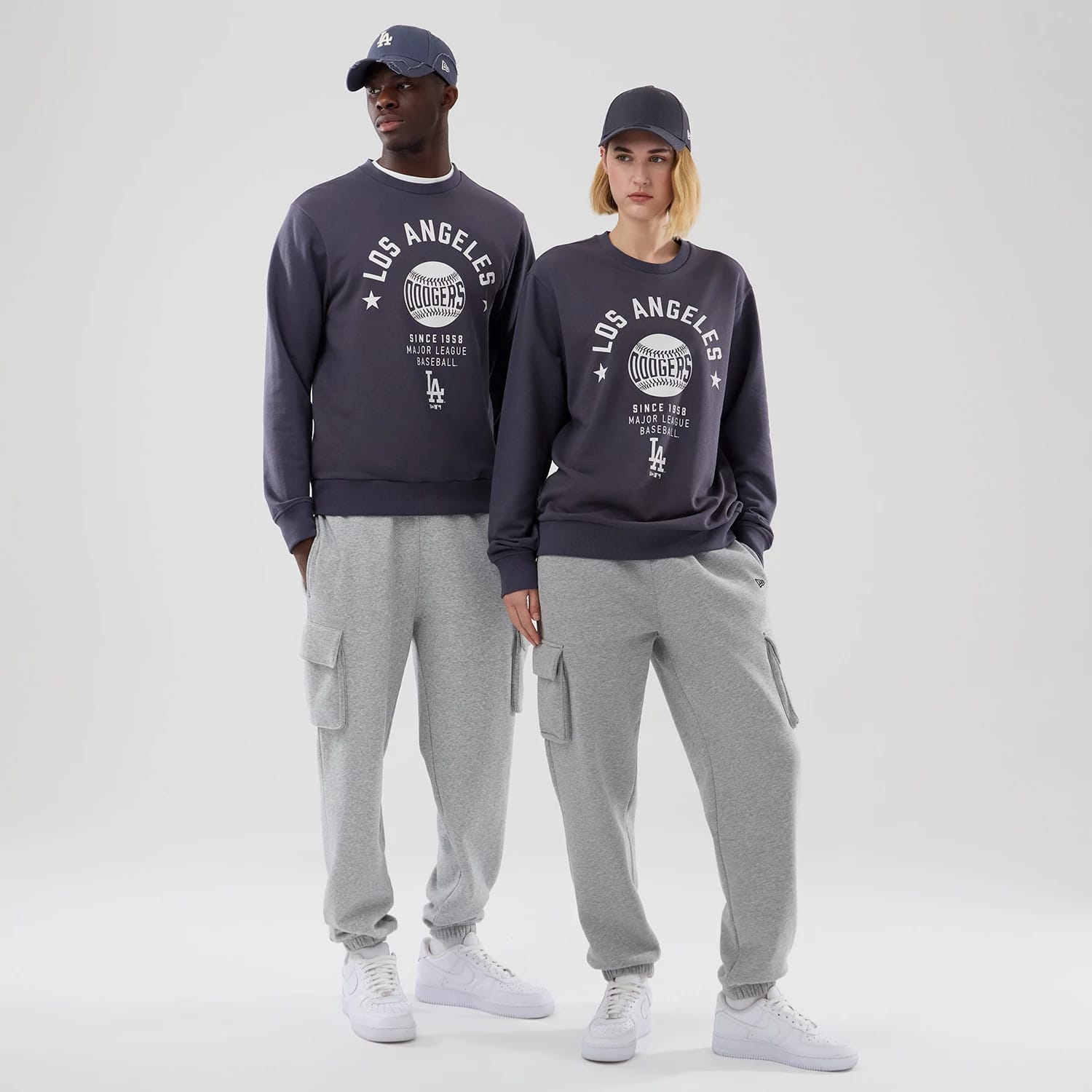 The model is wearing this MLB Graphic LA Dodgers Oversized Crew Neck Sweater in grey. 1