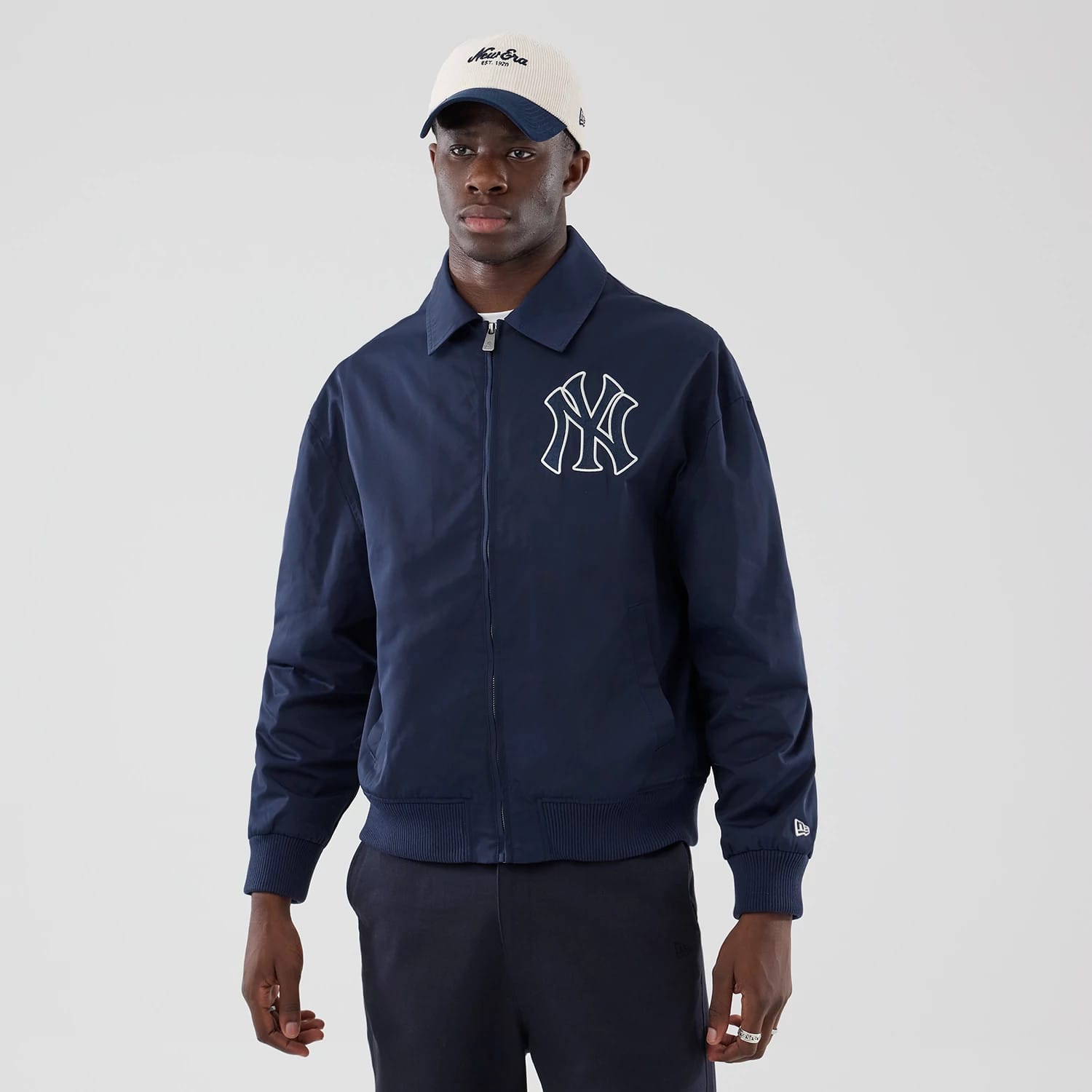 The model is wearing this MLB Collared New York Yankees Jacket in navy. 1