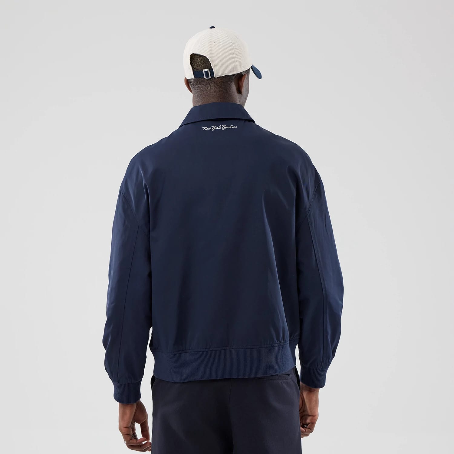 The model is wearing this MLB Collared New York Yankees Jacket in navy. 2