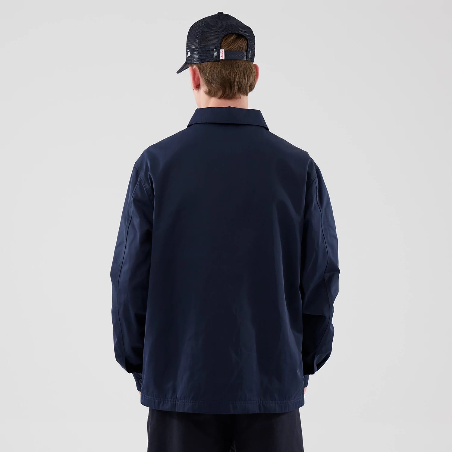 The model is wearing this New Era Shacket in navy. 2