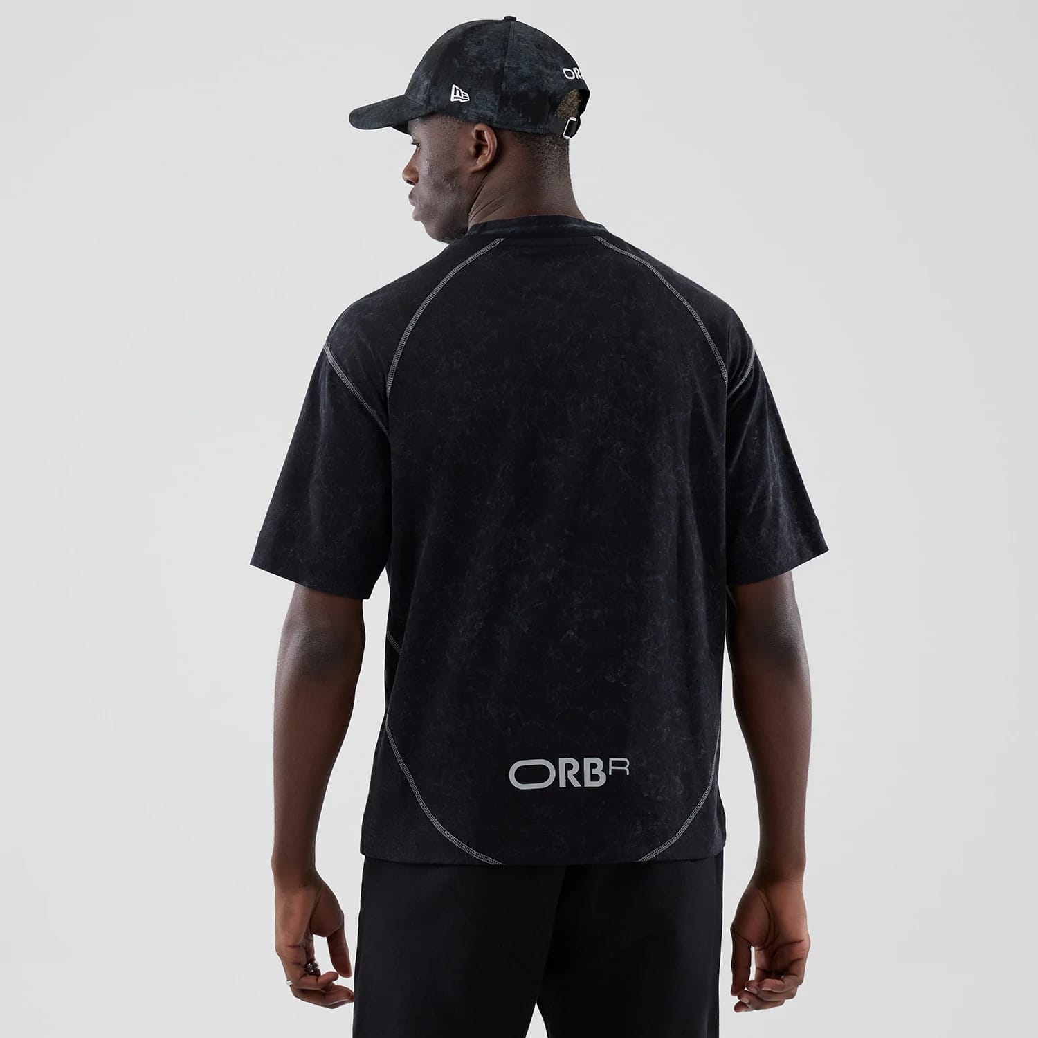 The model is wearing this Red Bull Racing Drop Shoulder T-Shirt in black. 2