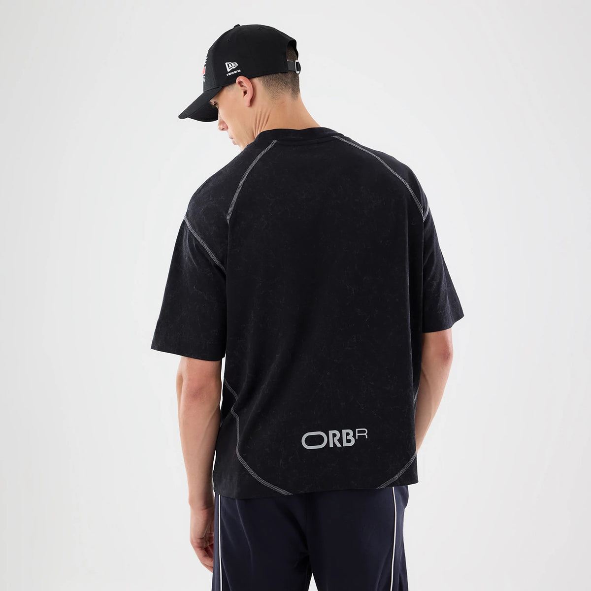 The model is wearing this Red Bull Racing Drop Shoulder T-Shirt in black. 2