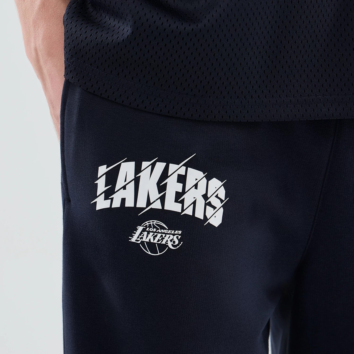 The model is wearing these NBA Core Plus LA Lakers Straight Leg Joggers in navy. 4