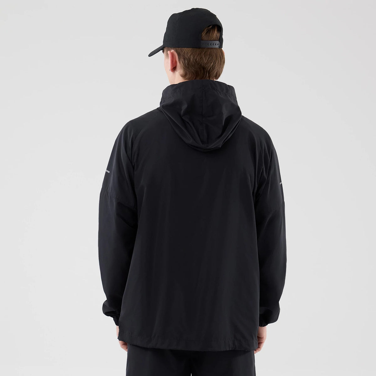The model is wearing this MLB Core Plus Windbreaker New York Yankees Jacket in black. 2