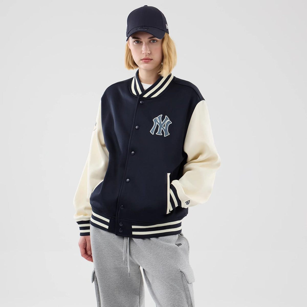 The model is wearing this MLB Jersey Bomber New York Yankees Jacket in navy. 4