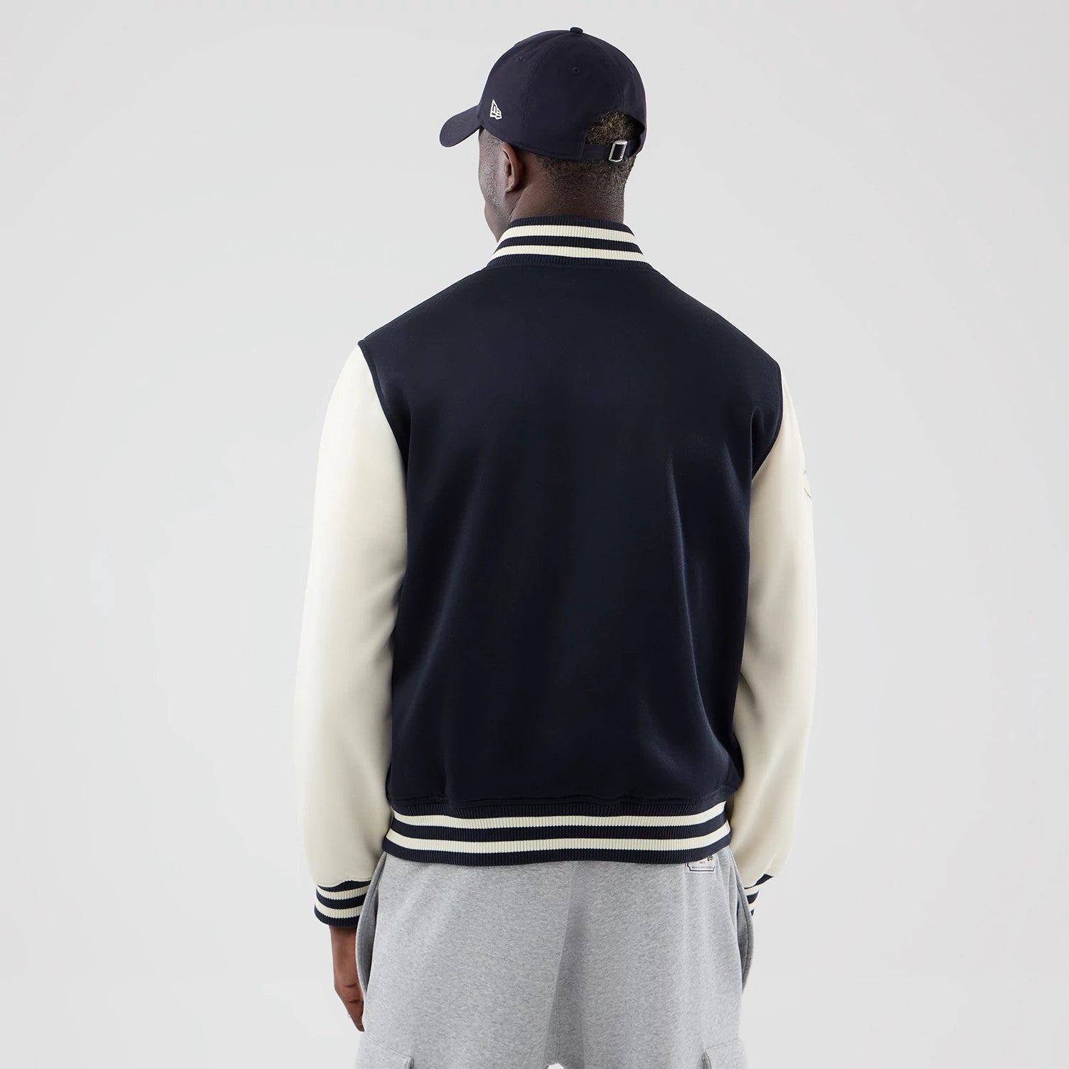 The model is wearing this MLB Jersey Bomber New York Yankees Jacket in navy. 2