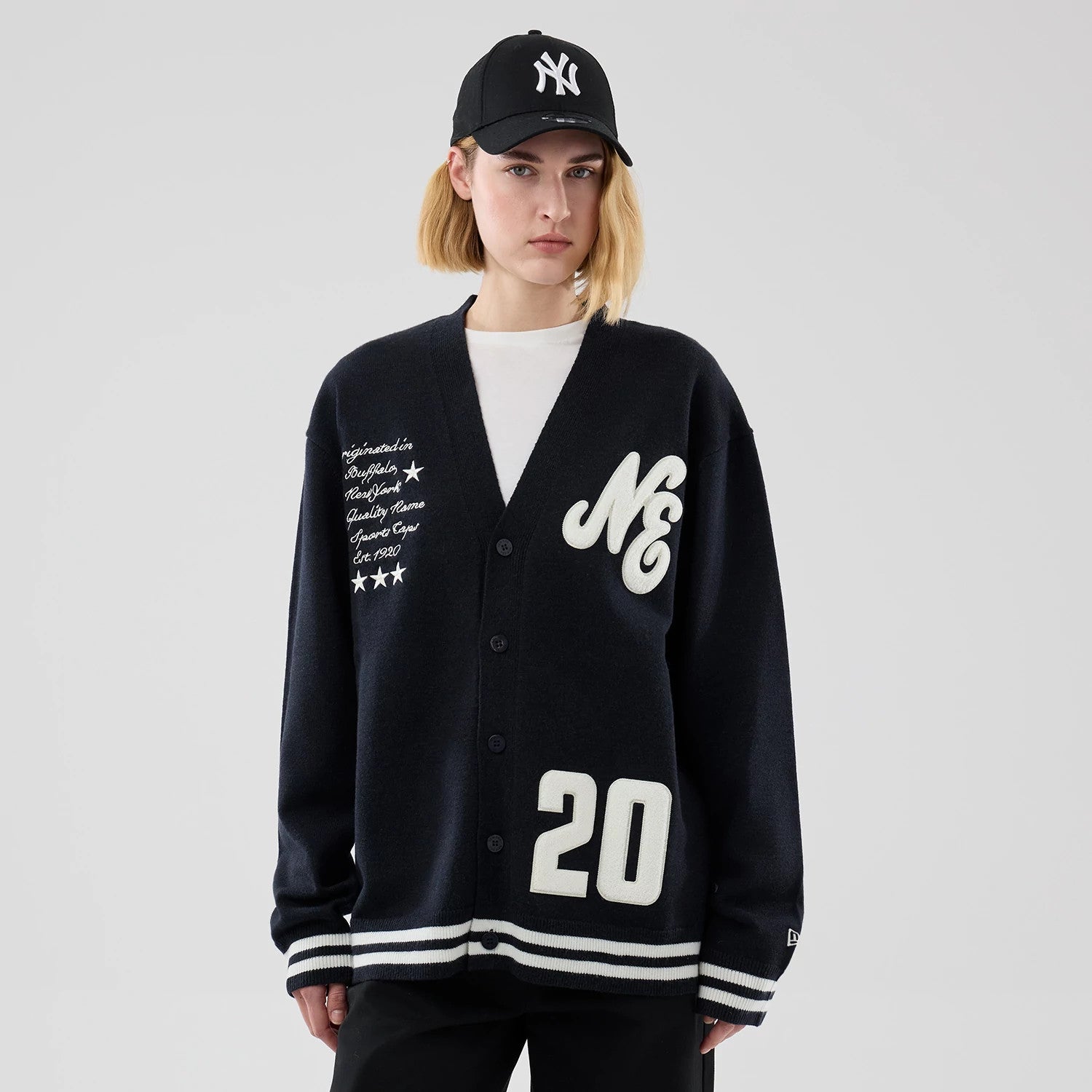The model is wearing this New Era Heritage Cardigan in navy. 4