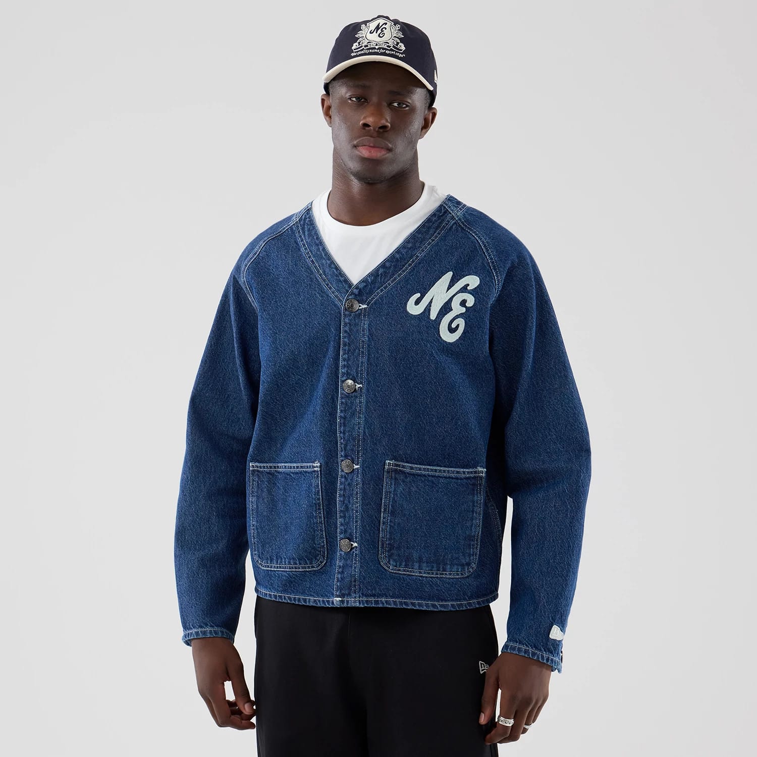 The model is wearing this New Era Denim Worker Jacket in dark blue. 1