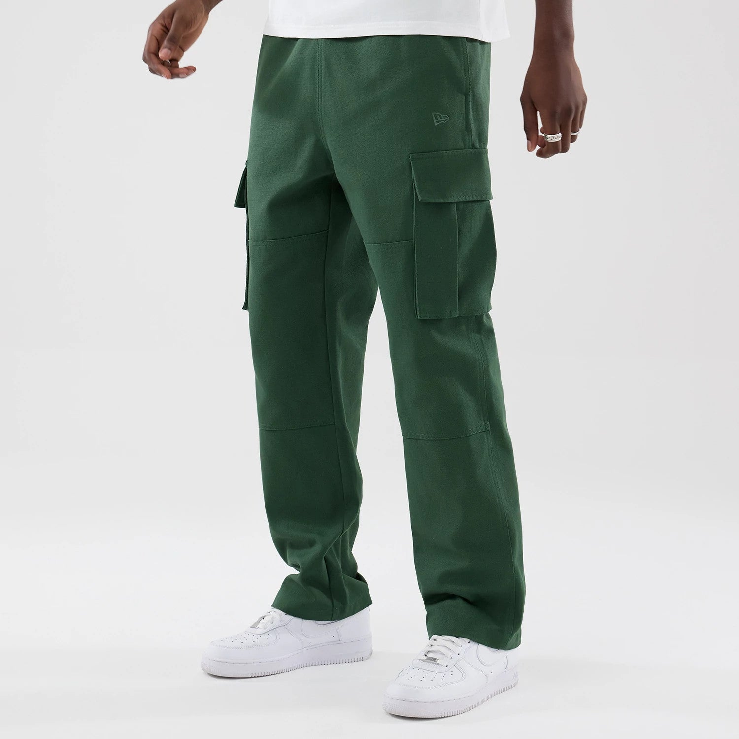 The model is wearing these New Era Cargo Trousers in dark green. 3