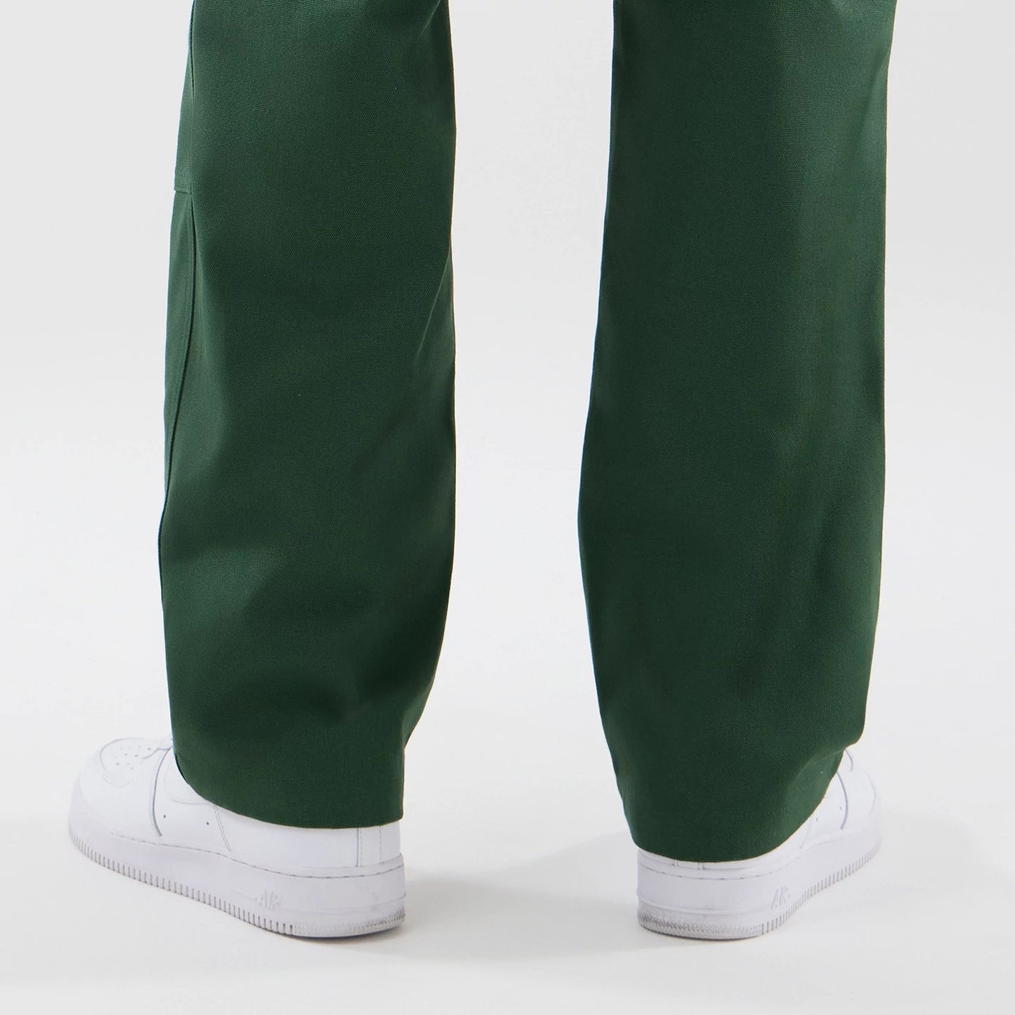 The model is wearing these New Era Cargo Trousers in dark green. 7