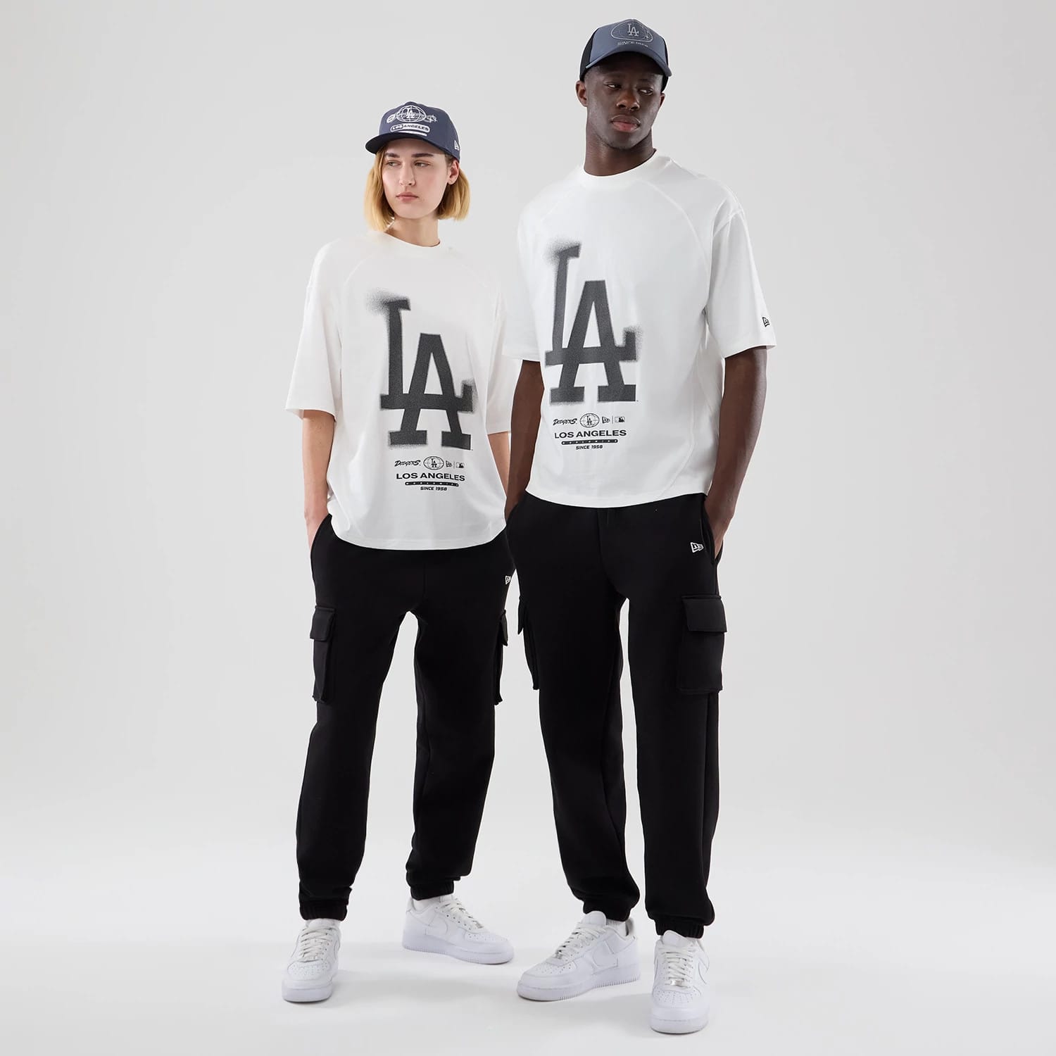 The model is wearing this MLB Graphic LA Dodgers Boxy T-Shirt in white. 1