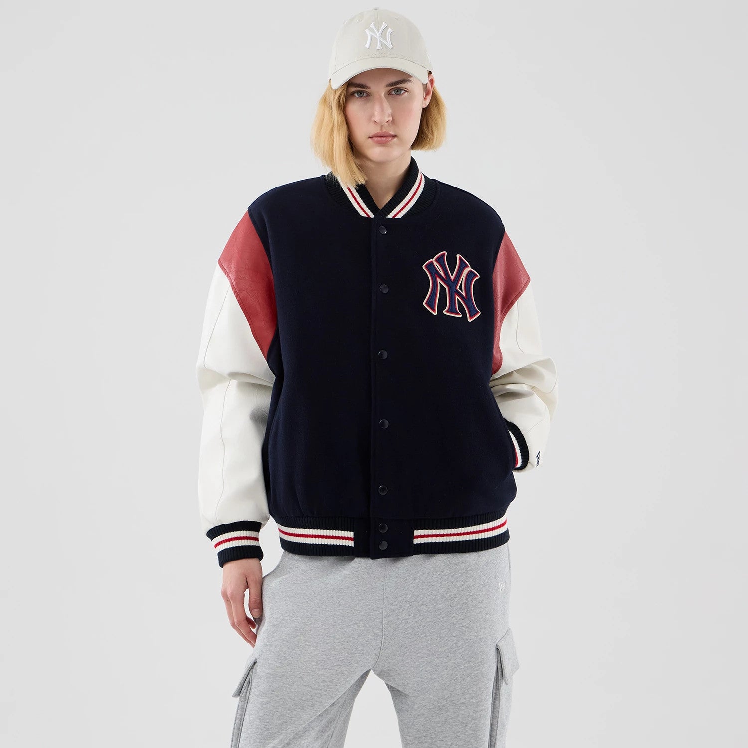 The model is wearing this MLB Varsity New York Yankees Jacket in navy. 4