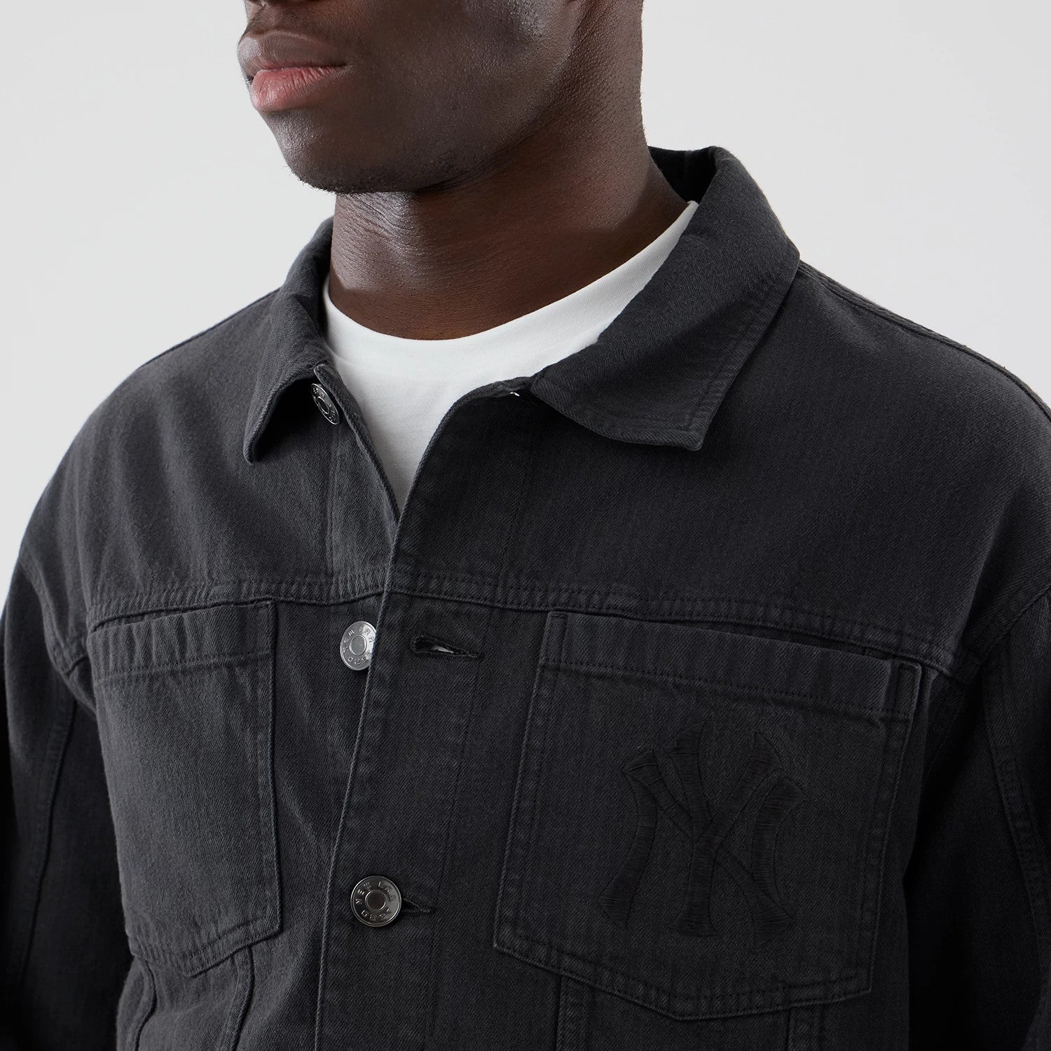 The model is wearing this MLB Stripe Denim New York Yankees Jacket in grey. 4