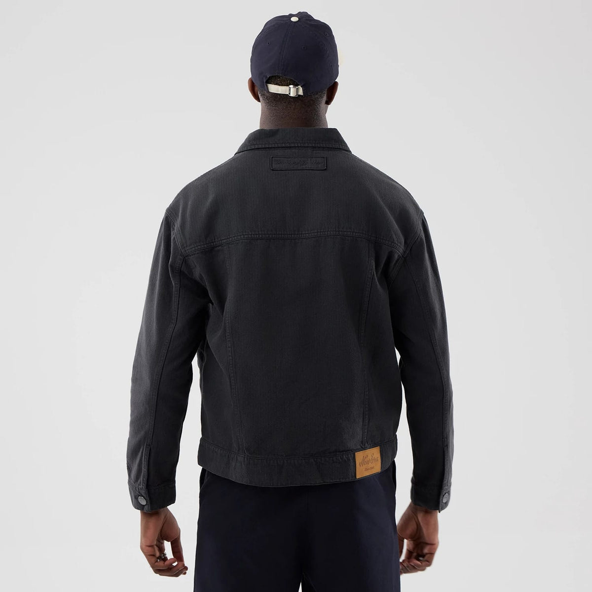 The model is wearing this MLB Stripe Denim New York Yankees Jacket in grey. 2