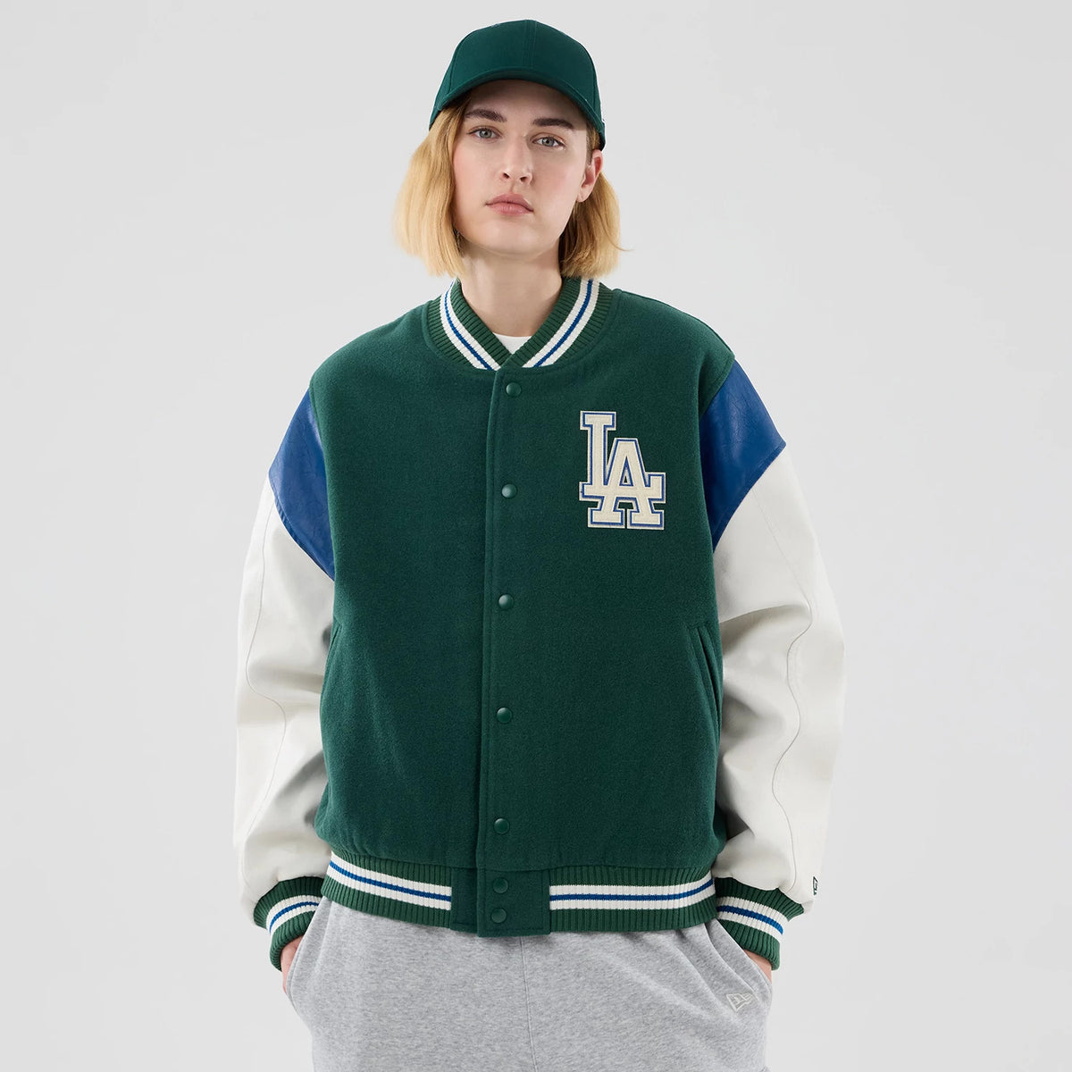 The model is wearing this MLB Varsity LA Dodgers Jacket in dark green. 4