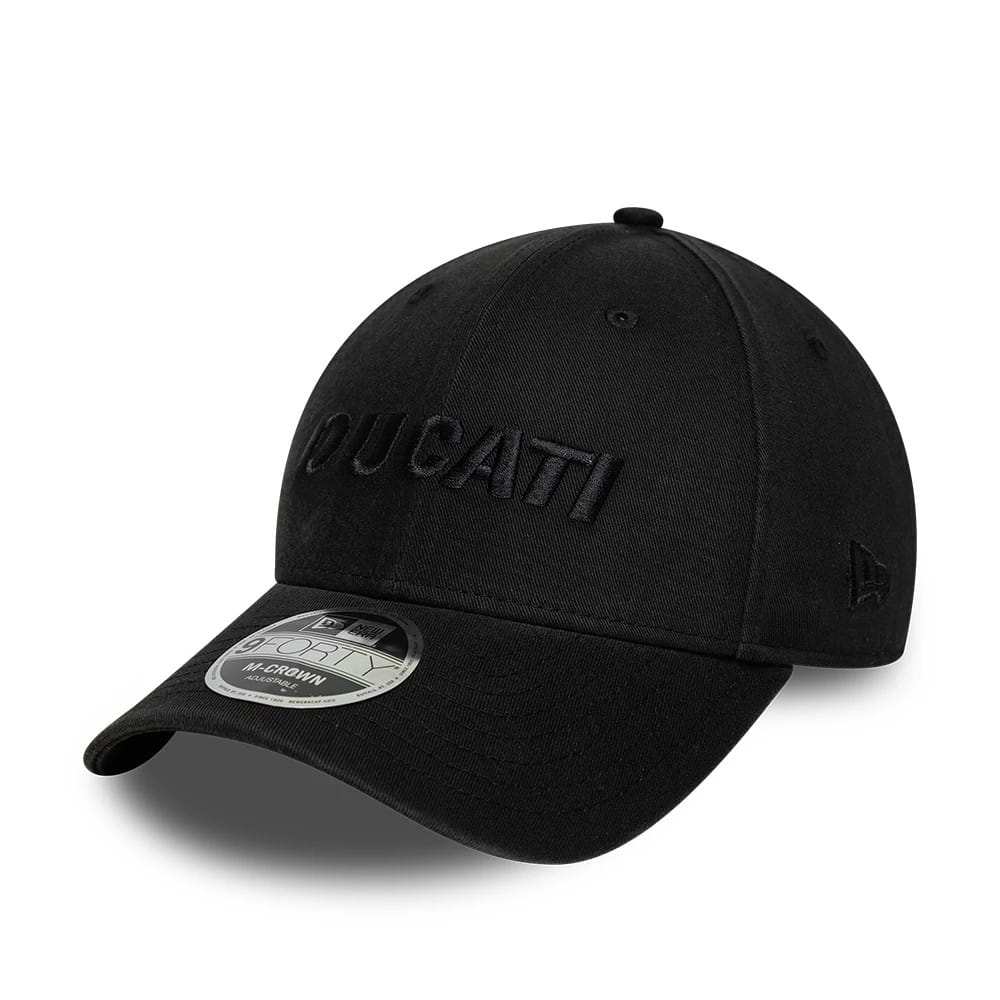 Ducati Motor Black On Black New Era 9FORTY M-Crown Adjustable Cap, three-quarter view showing the black embroidered Ducati logo on the front panel, a curved black visor with a 9FORTY size sticker, and the New Era flag logo on the left side.