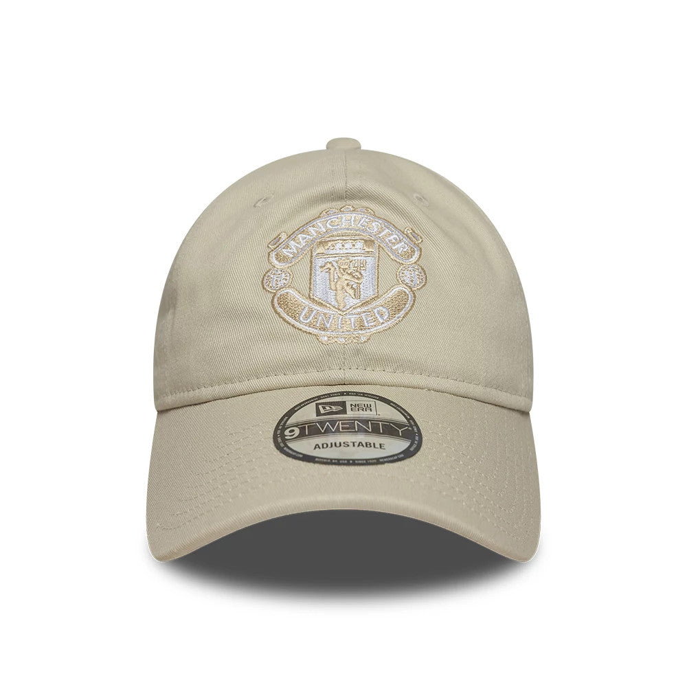 Manchester United FC Cream New Era 9TWENTY Adjustable Cap, front view showing the cream embroidered club crest on the unstructured crown, with a curved visor and a 9TWENTY size sticker centrally placed.