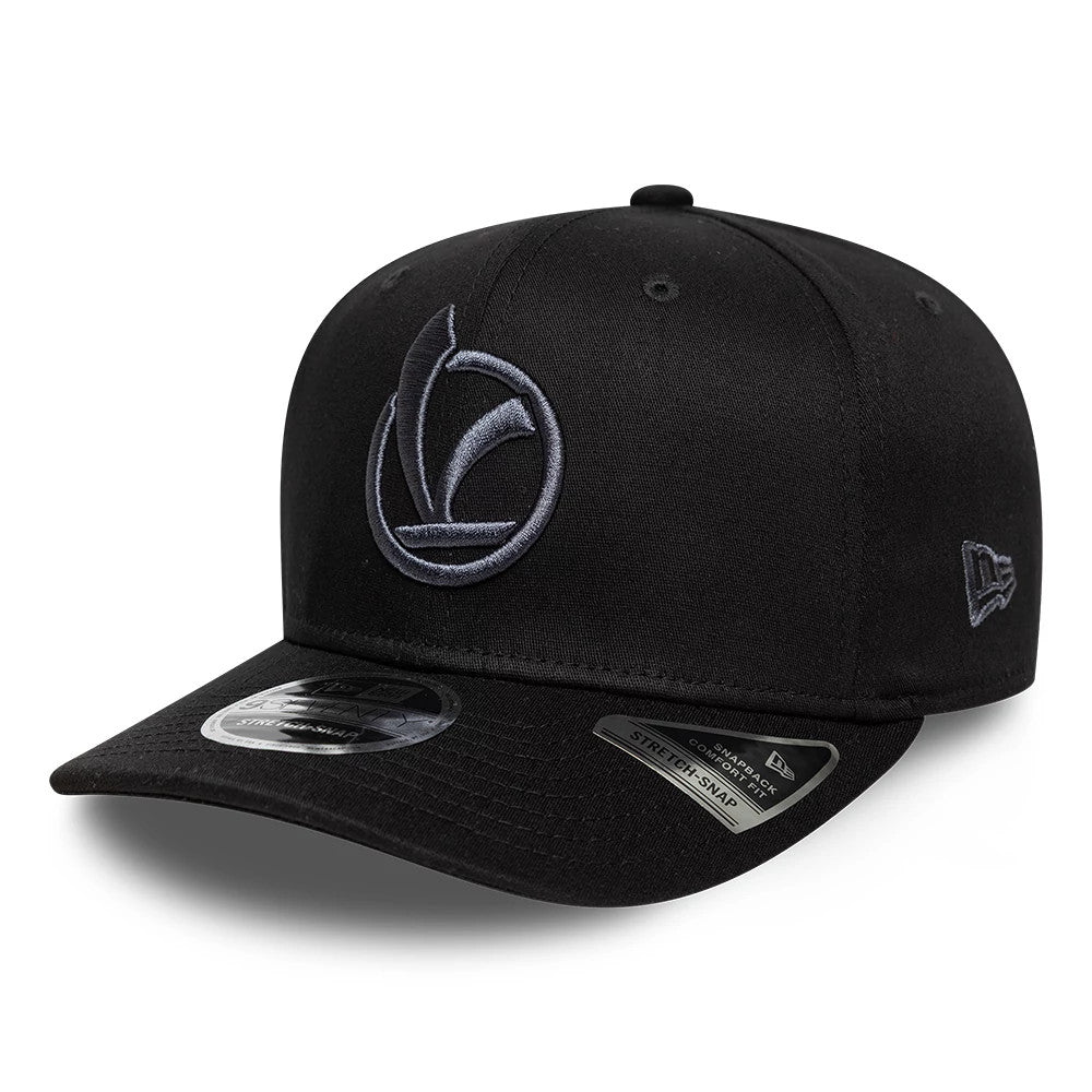 Vespa Black New Era 9SEVENTY Stretch Snap Adjustable Cap, front view showing a grey embroidered Vespa logo on the structured black crown, with a matching black visor, eyelets and a 9SEVENTY size sticker on the visor.