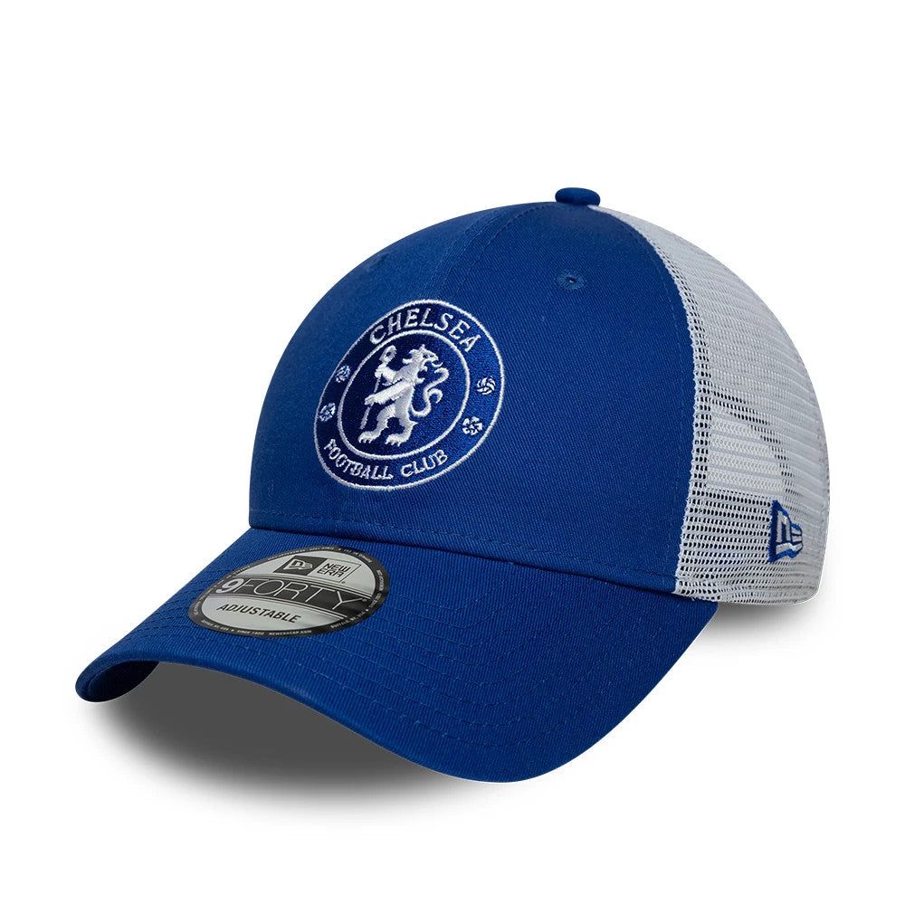 Chelsea FC League Blue New Era 9FORTY Adjustable Cap, three-quarter view showing the white embroidered Chelsea crest prominently on the blue front panel, with a curved visor featuring the 9FORTY size sticker, and a mesh back with a New Era flag logo.