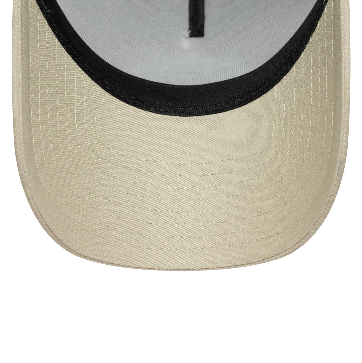 Newcastle United FC Faux Suede Cream New Era 9FORTY E-Frame Trucker Adjustable Cap, inside view showing the black sweatband, the black taping running through the centre, and the light grey undervisor.